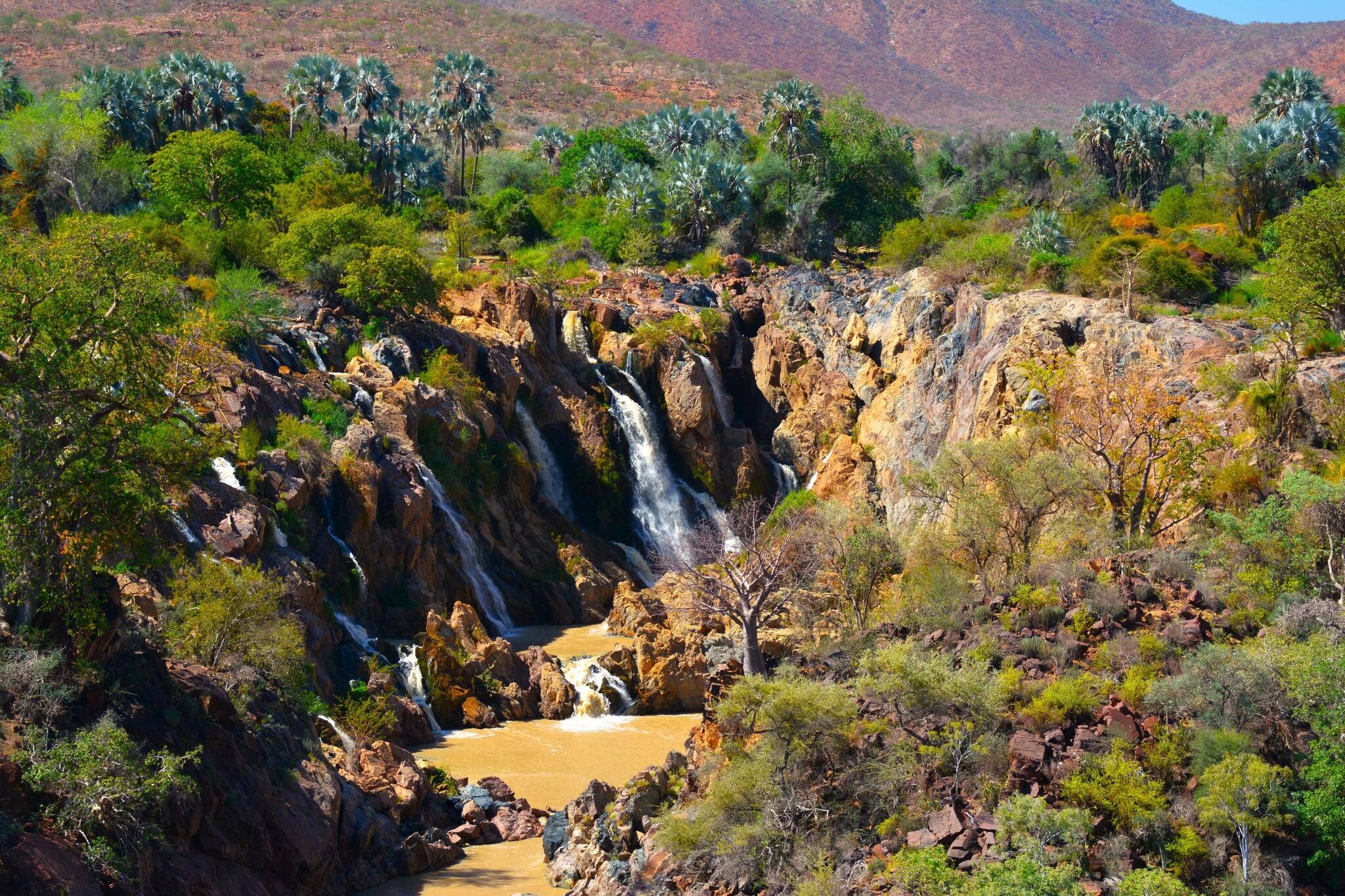 Epupa Falls (also known as Monte Negro Falls) - a series of large waterfalls formed by the Cunene River on the border of Angola and Namibia, in the Kaokoland area (Africa)