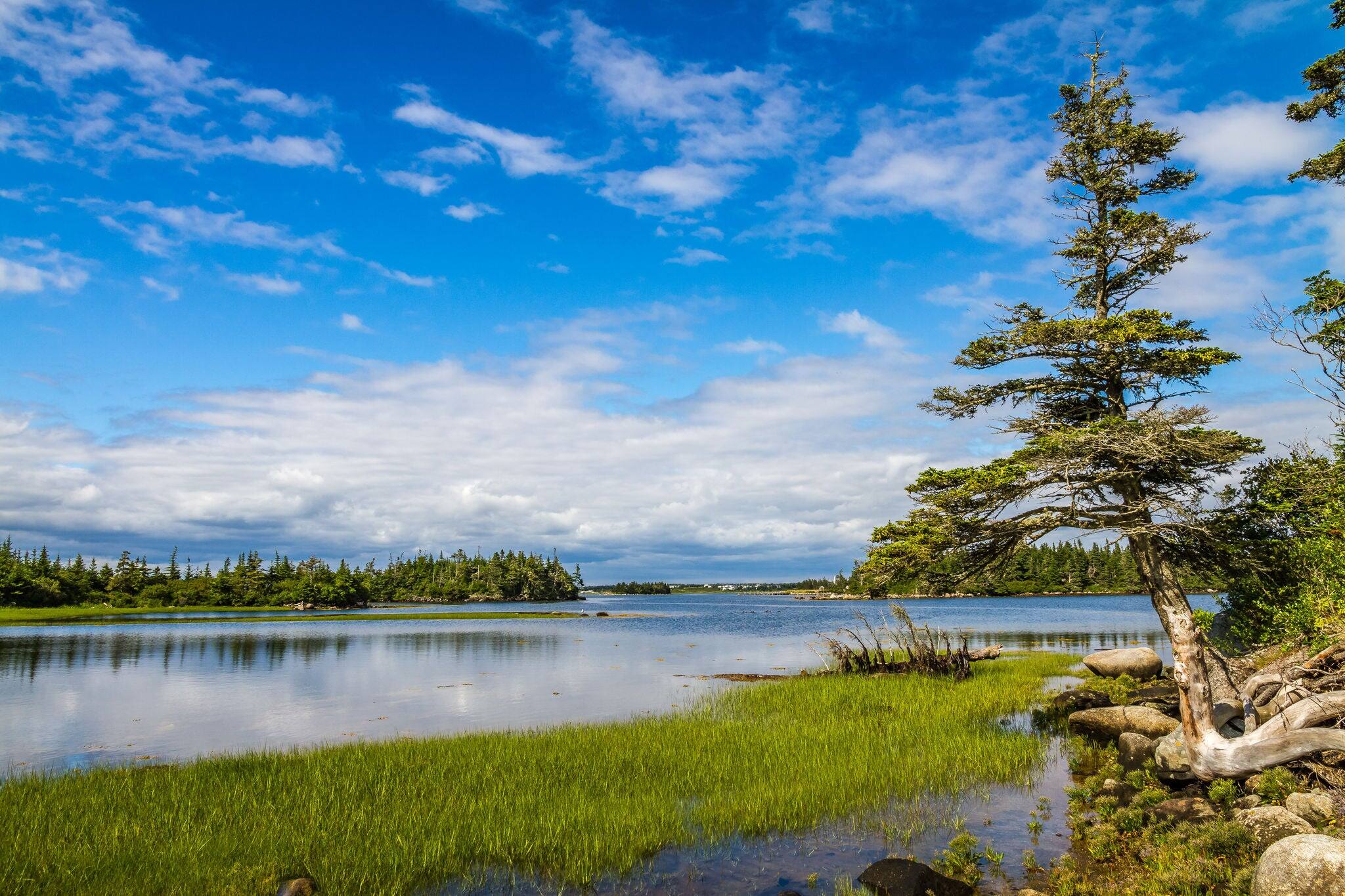 Beautiful scenery of Atlantic Canada Nova Scotia Shelburne County coastline and shorelines with a golden sky is a beauty to behold.