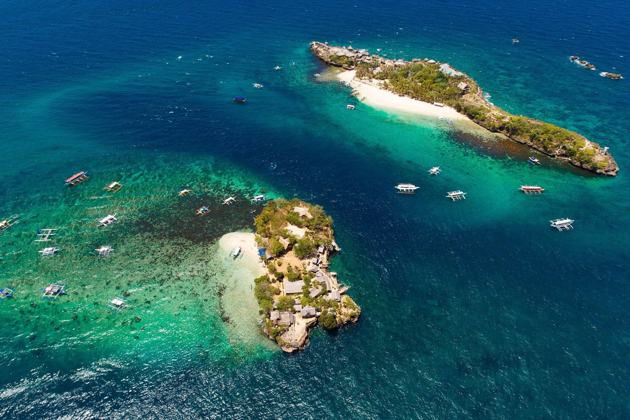 Aerial view of beautiful bay in tropical Island with very white sand. Boracay Island, Philippines.