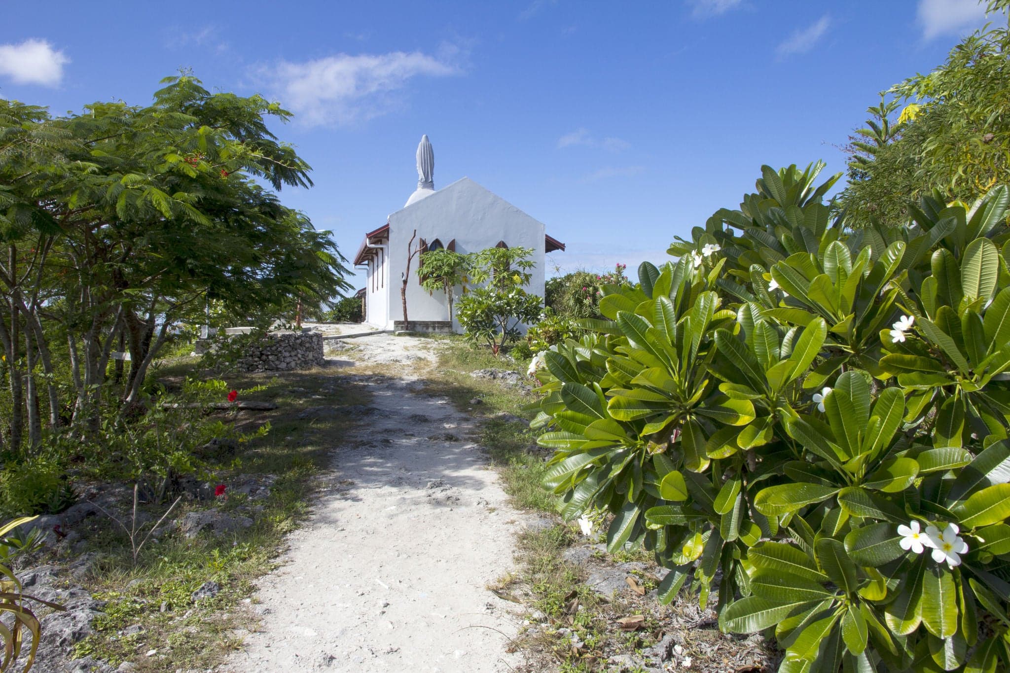 Lifou, New Caledonia. Path leading up to Our Lady of Lourdes Chapel. The chapel was built in 1898 by visiting Catholic missionaries.