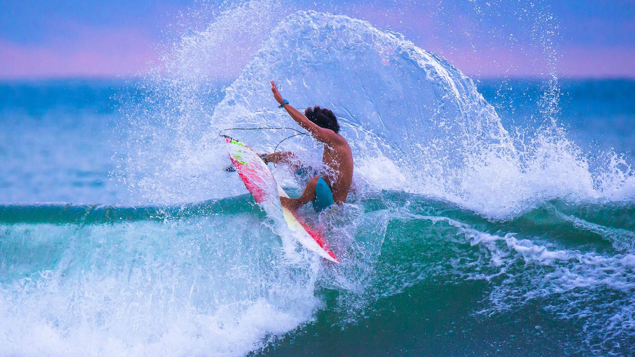 Riding the waves. Jaco Beach, Costa Rica, surf paradise