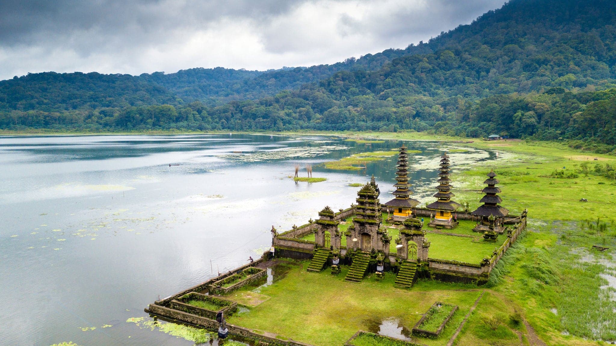 Aerial view of hindu temple ruins of Pura Hulun Danu at the Tamblingan lake, Bali, Indonesia