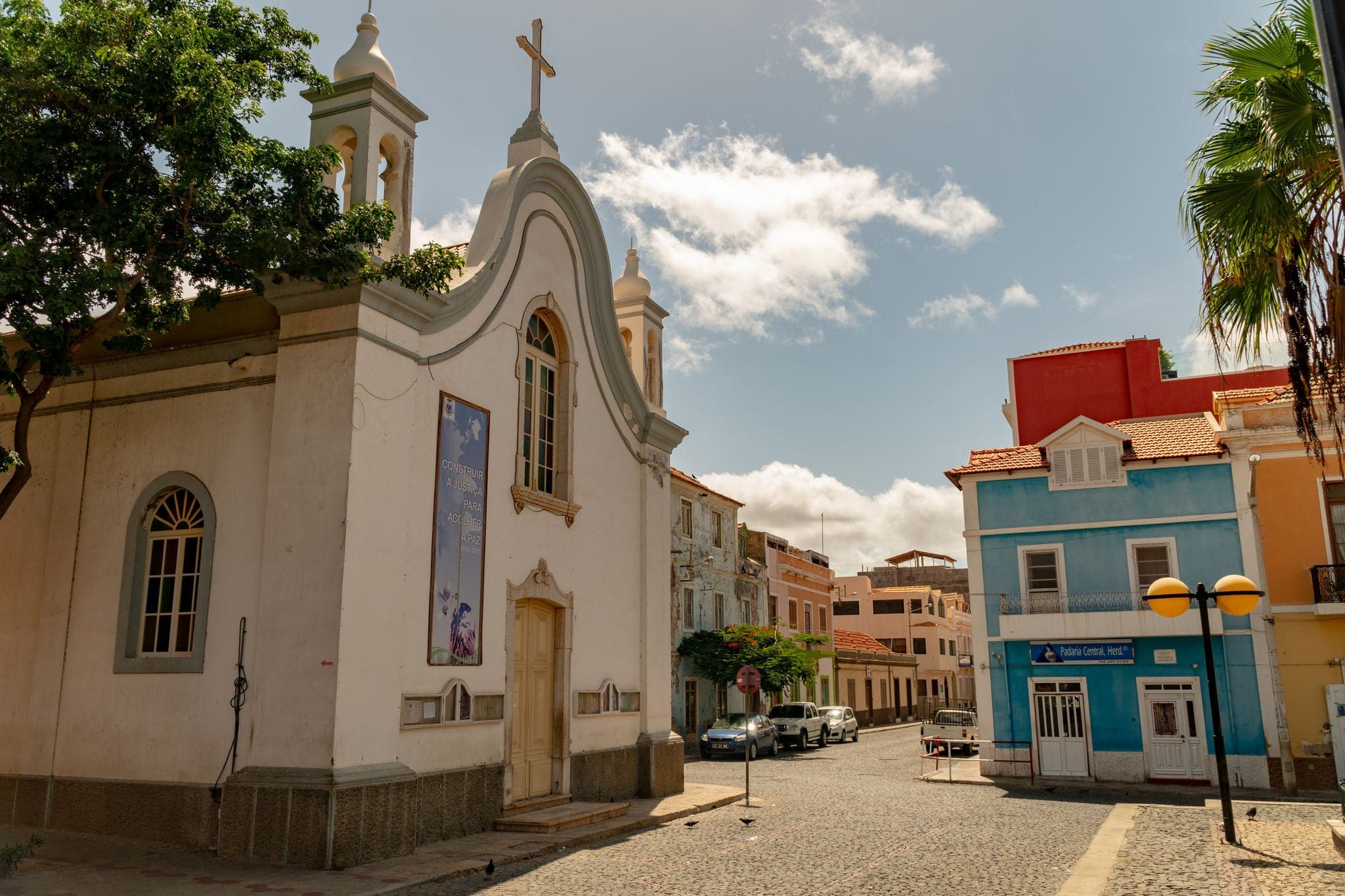 MINDELO, CAPE VERDE - OCTOBER 28, 2018: empty street in front of the church Nossa Senhora da Luz in Mindelo, Cape Verde islands on October 28, 2018.