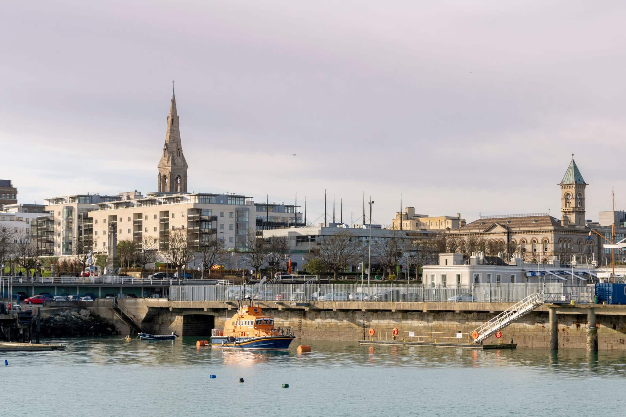 Dun Laoghaire harbour of County Wicklow in Ireland . Lifeboat on the coast.