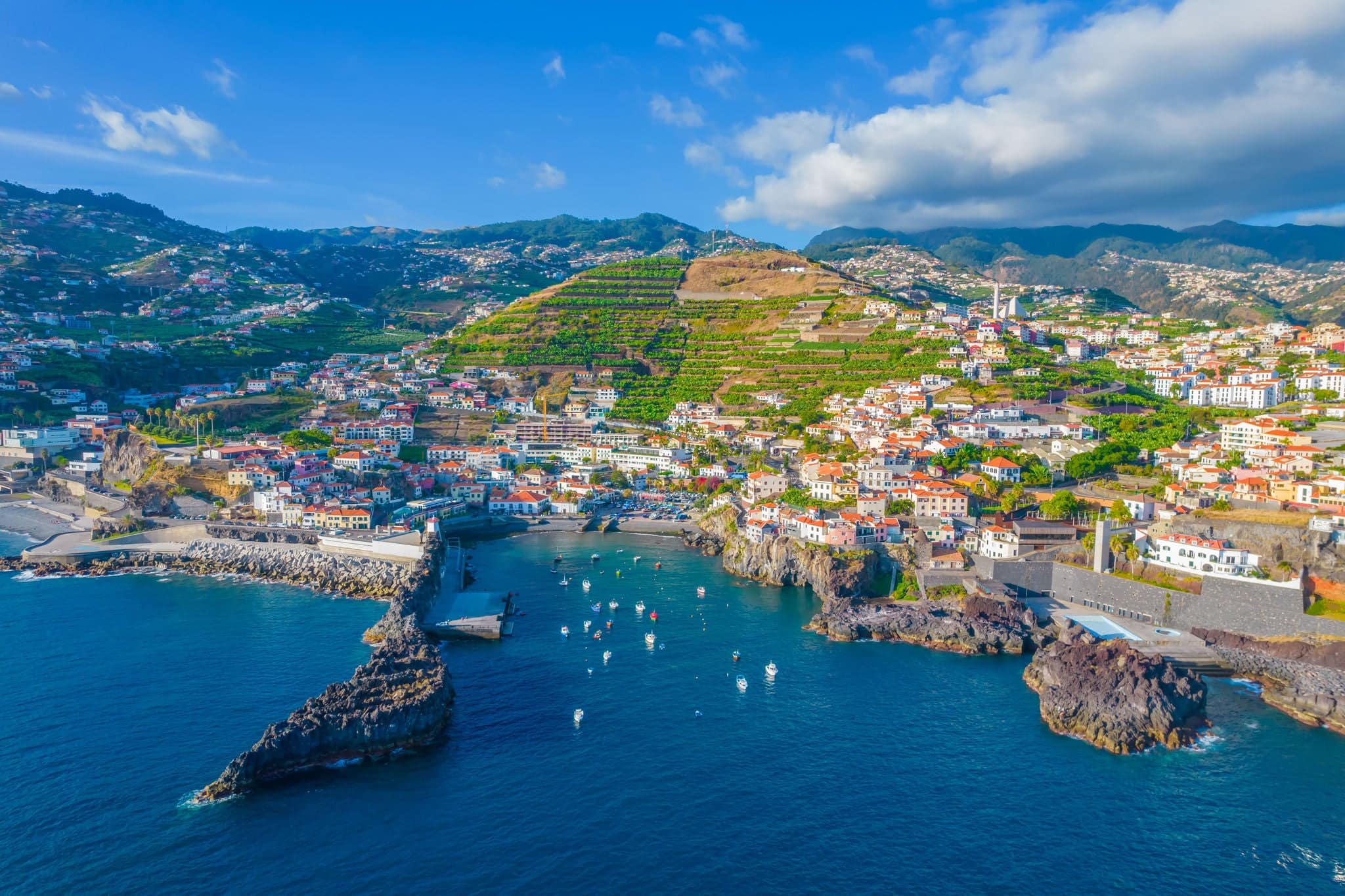 Aerial drone view of Camara de Lobos village panorama near to Funchal, Madeira. Small fisherman village with many small boats in a bay