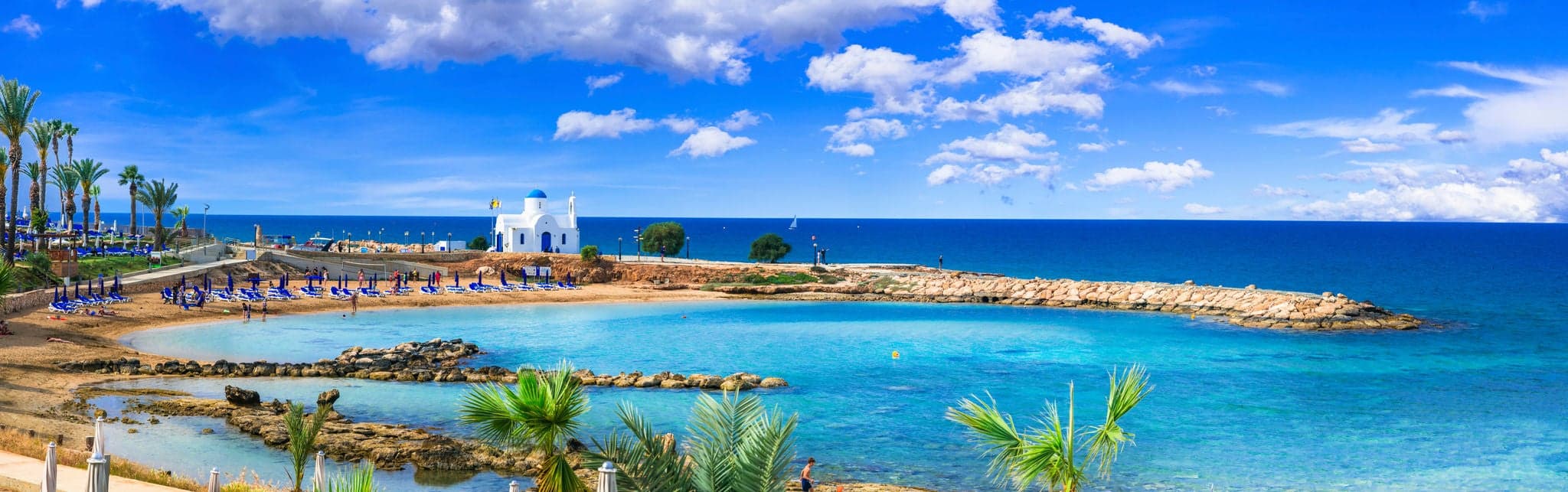 Cyprus island - best beaches. Scenic Louma beach with little church Agios Nikolaos