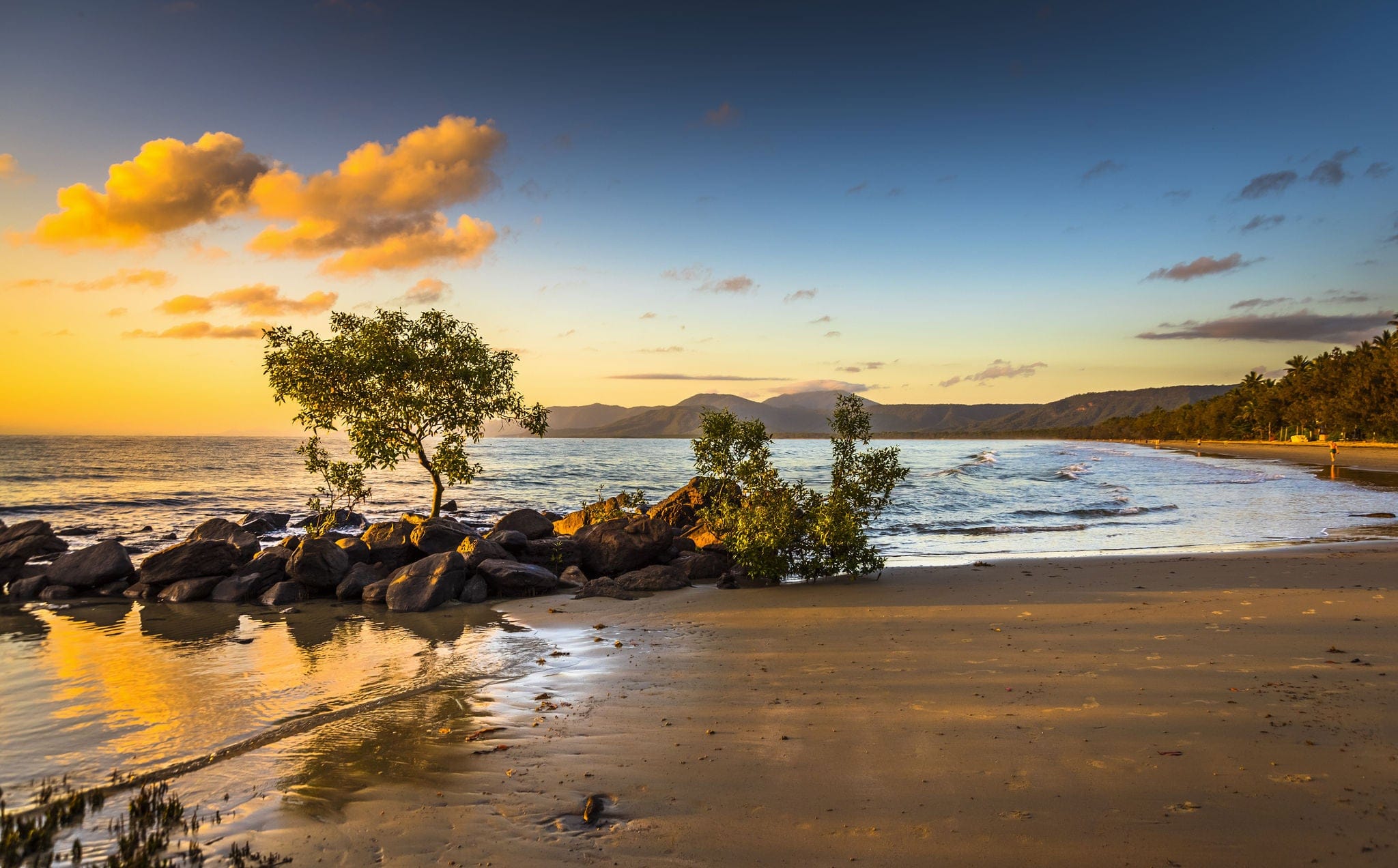 colourful sunrise 4 mile beach tropical Port Douglas Coral sea clear calm ocean morning north queensland