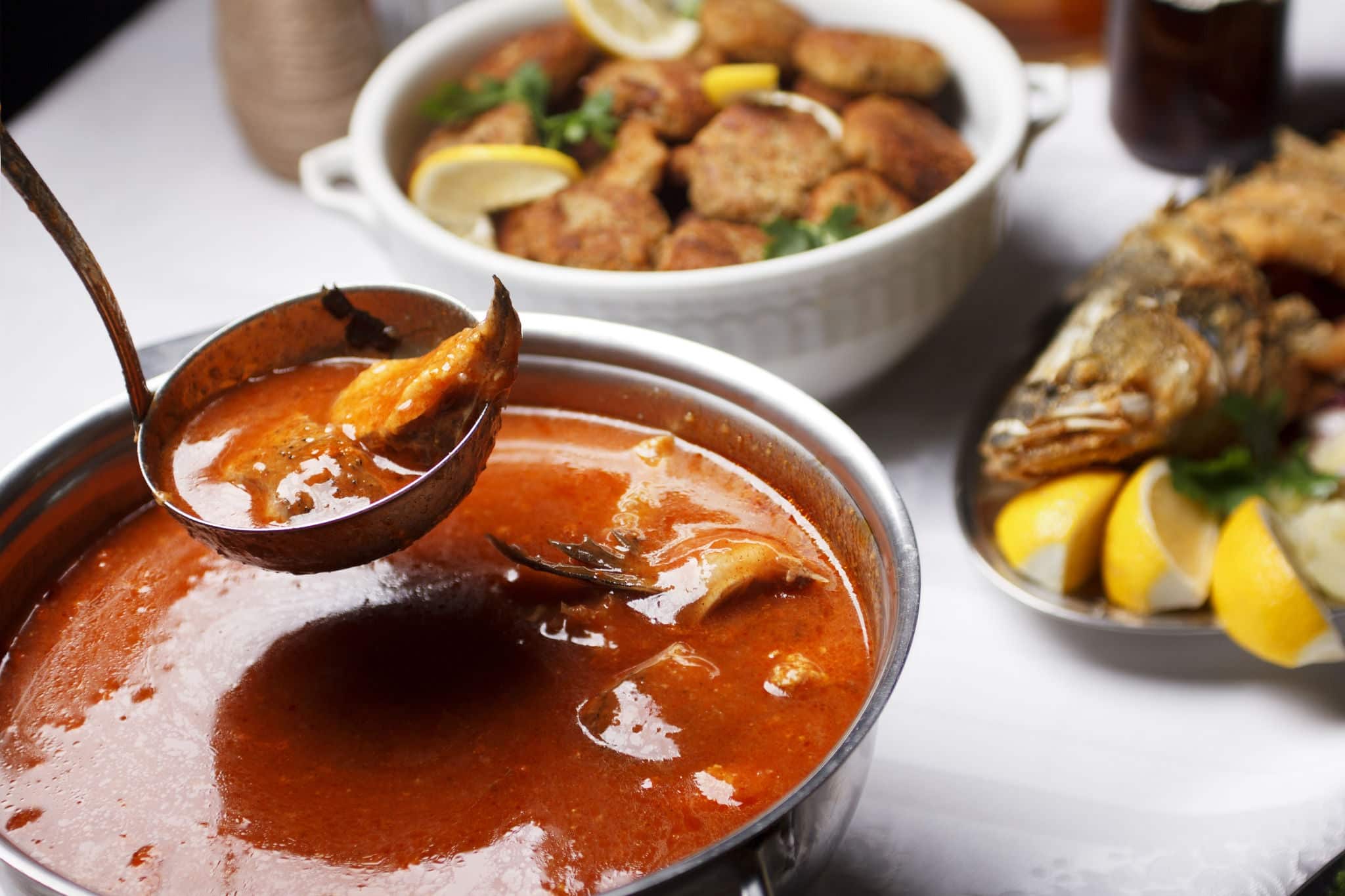 Fish stew on served restaraunt table