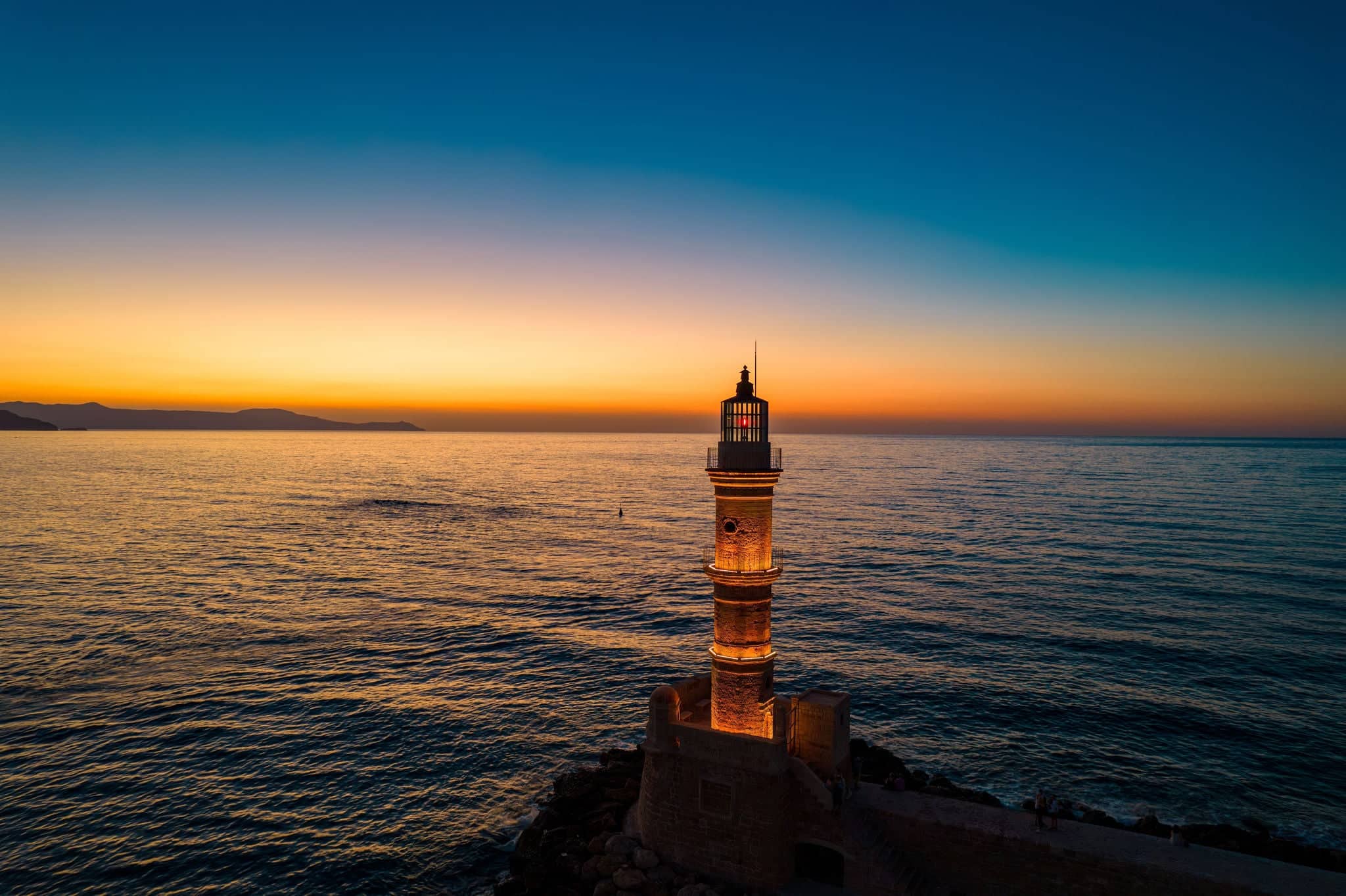 Aerial view  of the iconic old  lighthouse of  chania, Crete, Greece during sunset