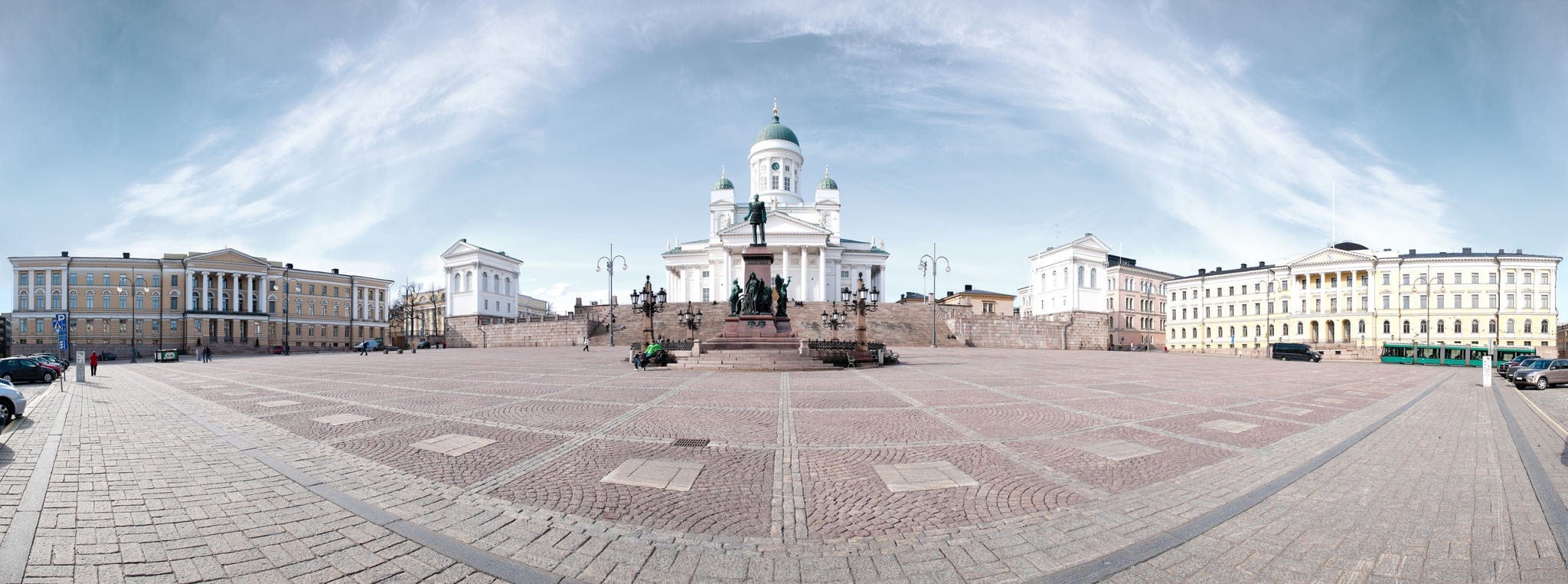 panorama view of the Helsinki cathedral square with blue cloudy sky in background