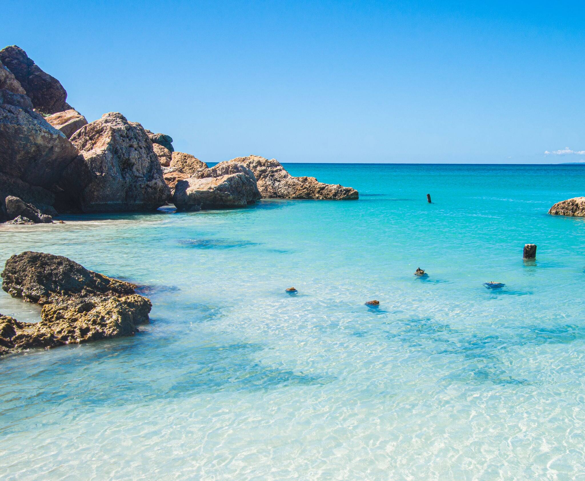 A beautiful turquoise cove on the Isla de Cajo de Muertos in the Caribbean Sea 10 miles off the coast of Ponce, Puerto Rico, USA. Copy space.