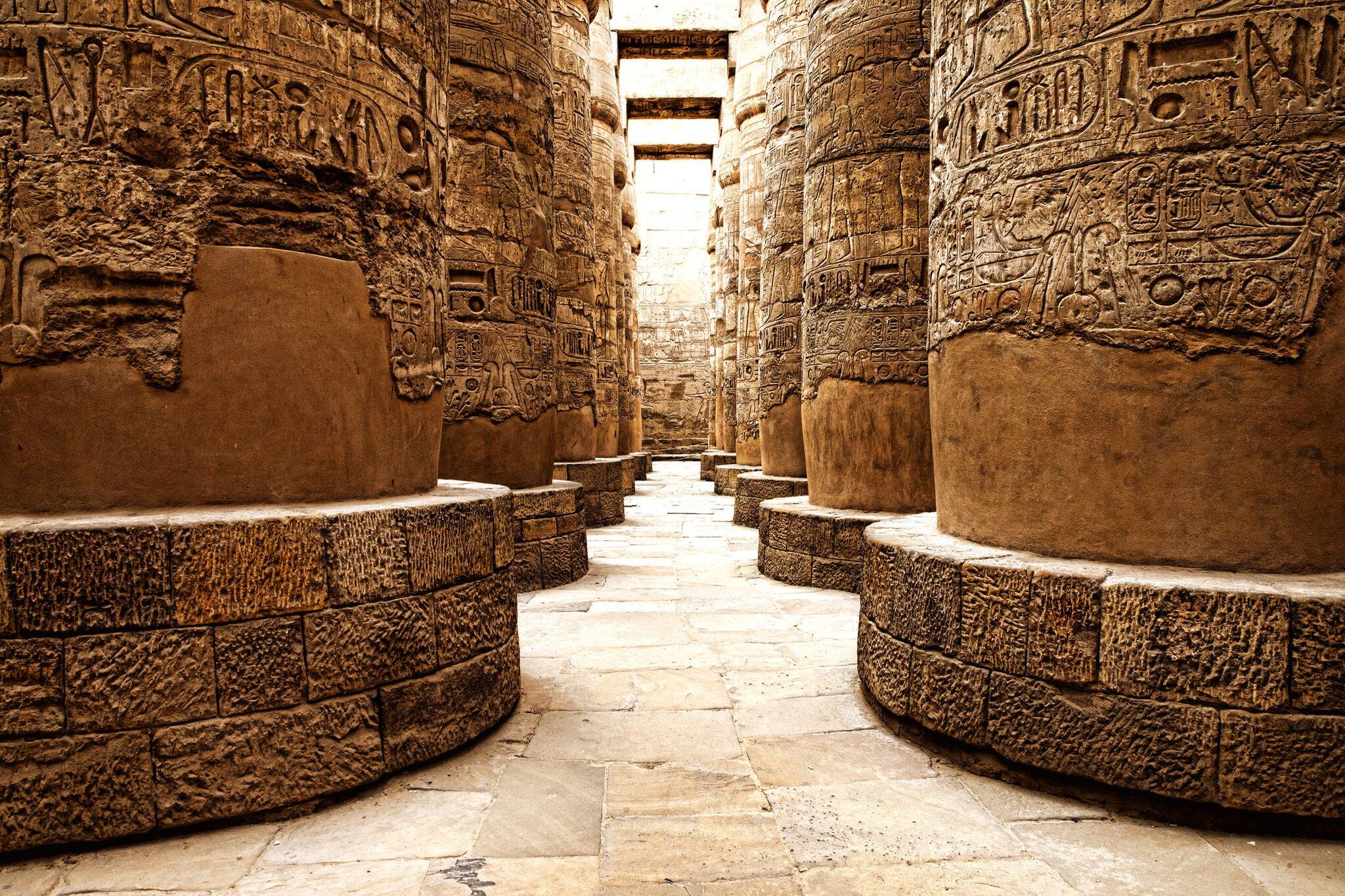 Close up of columns covered in hieroglyphics, Karnak, Egypt.