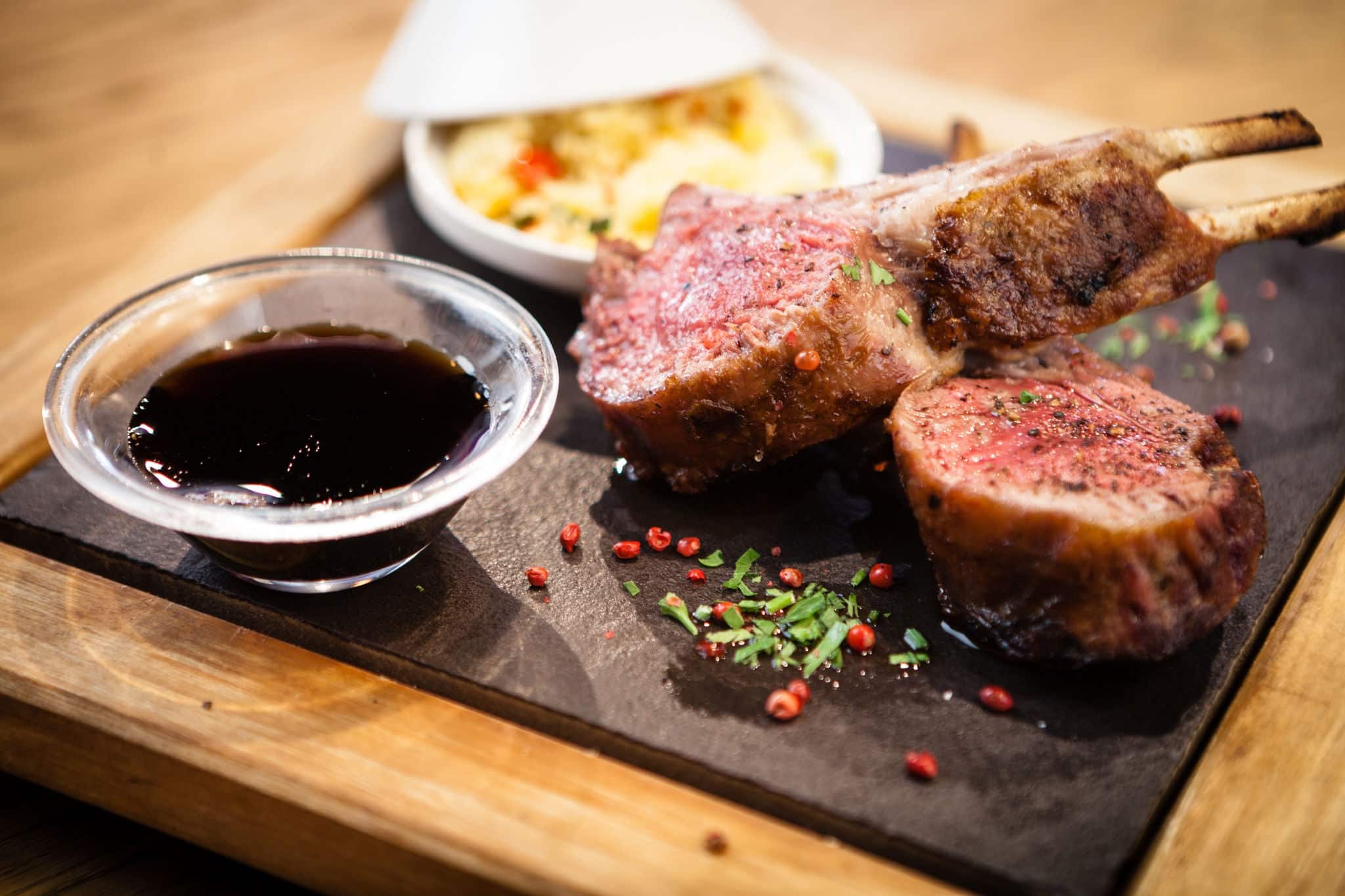 Rack of New Zealand lamb. Served with couscous and pomegranate sauce.