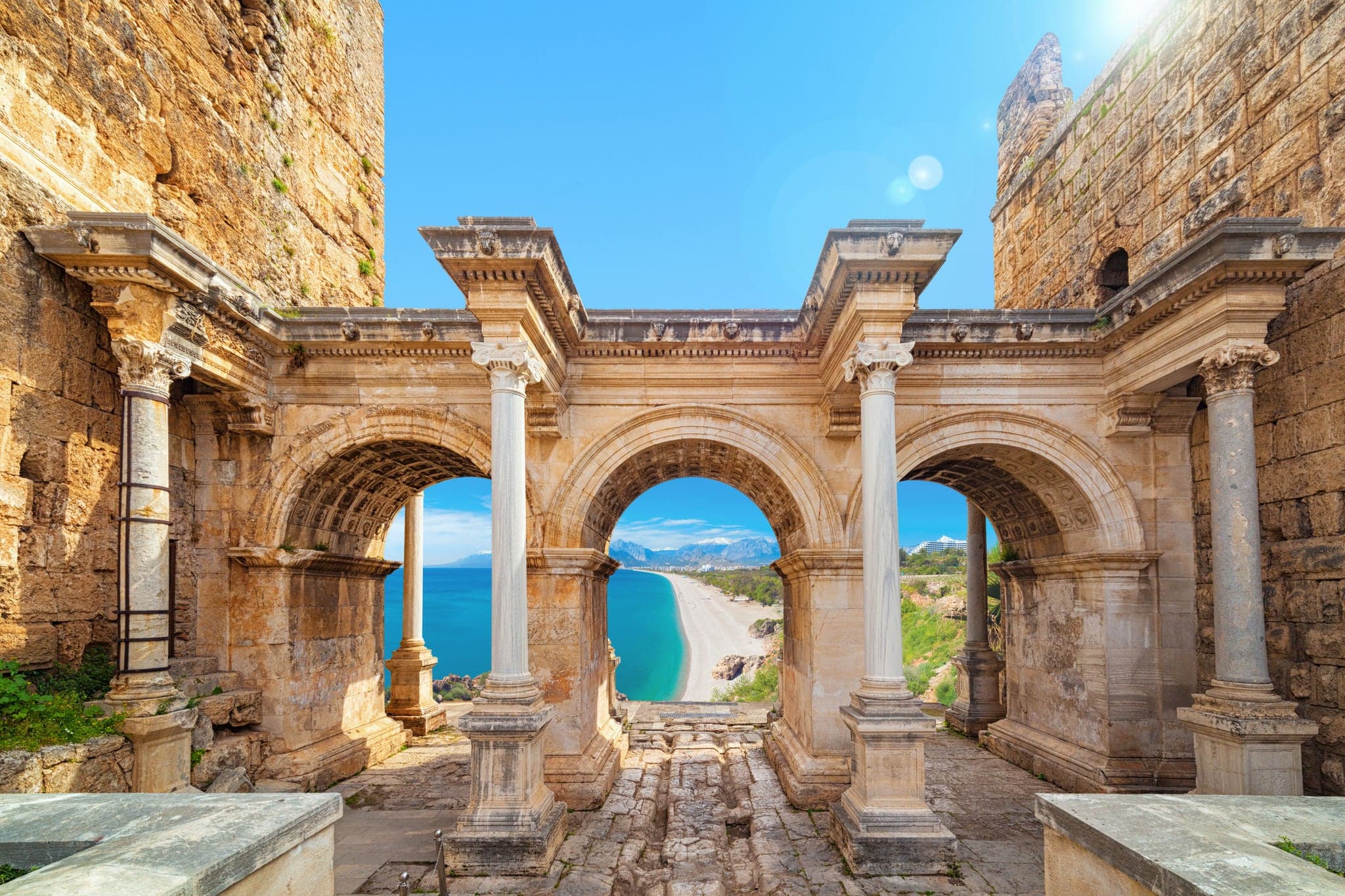 Welcome to amazing Antalya concept. Collage of famous landmarks: Hadrian's Gate old town Kaleici district and Konyaalti beach in popular resort city Antalya, Turkey
