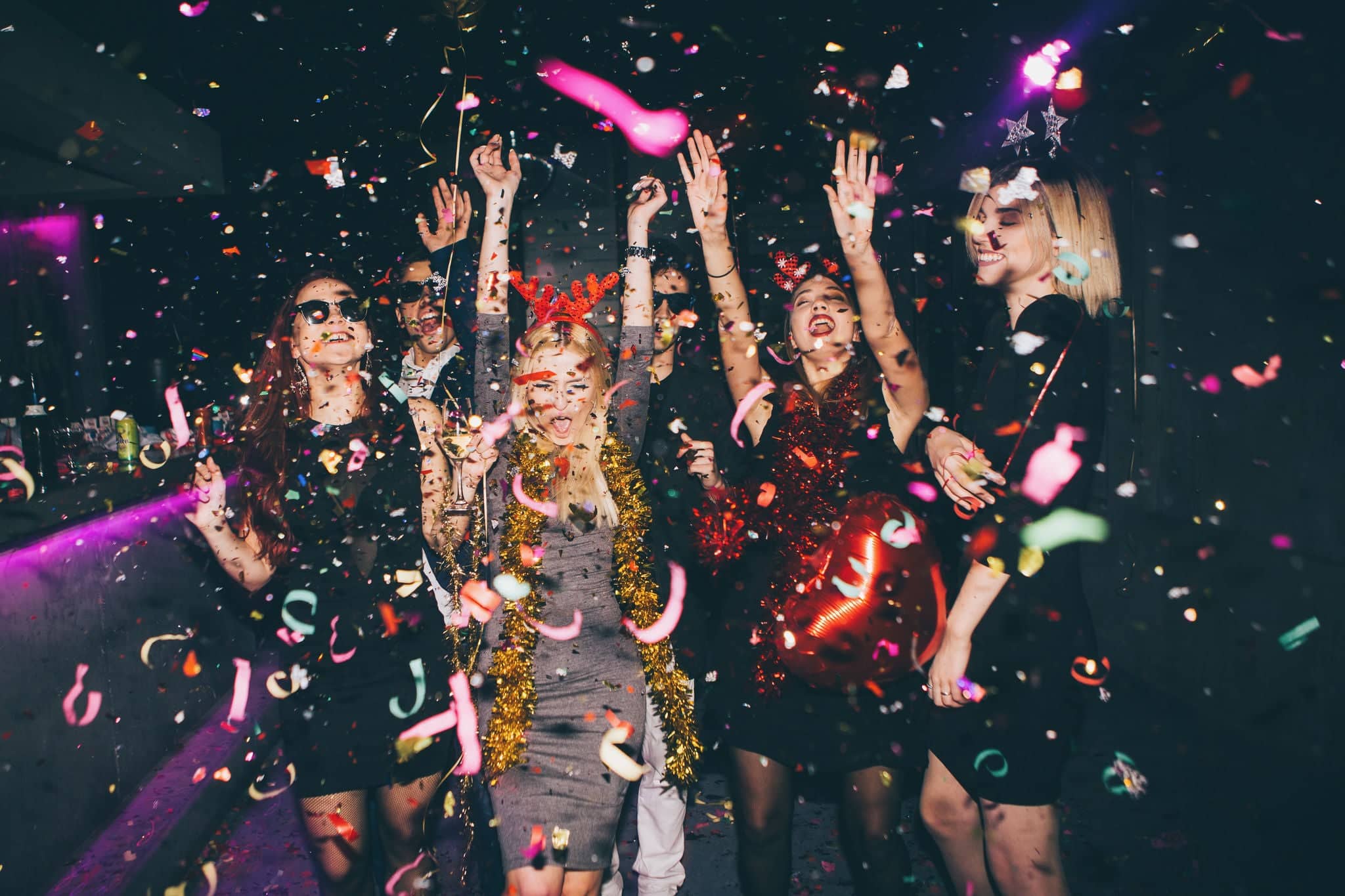 Group of friends at club having fun. New year's party