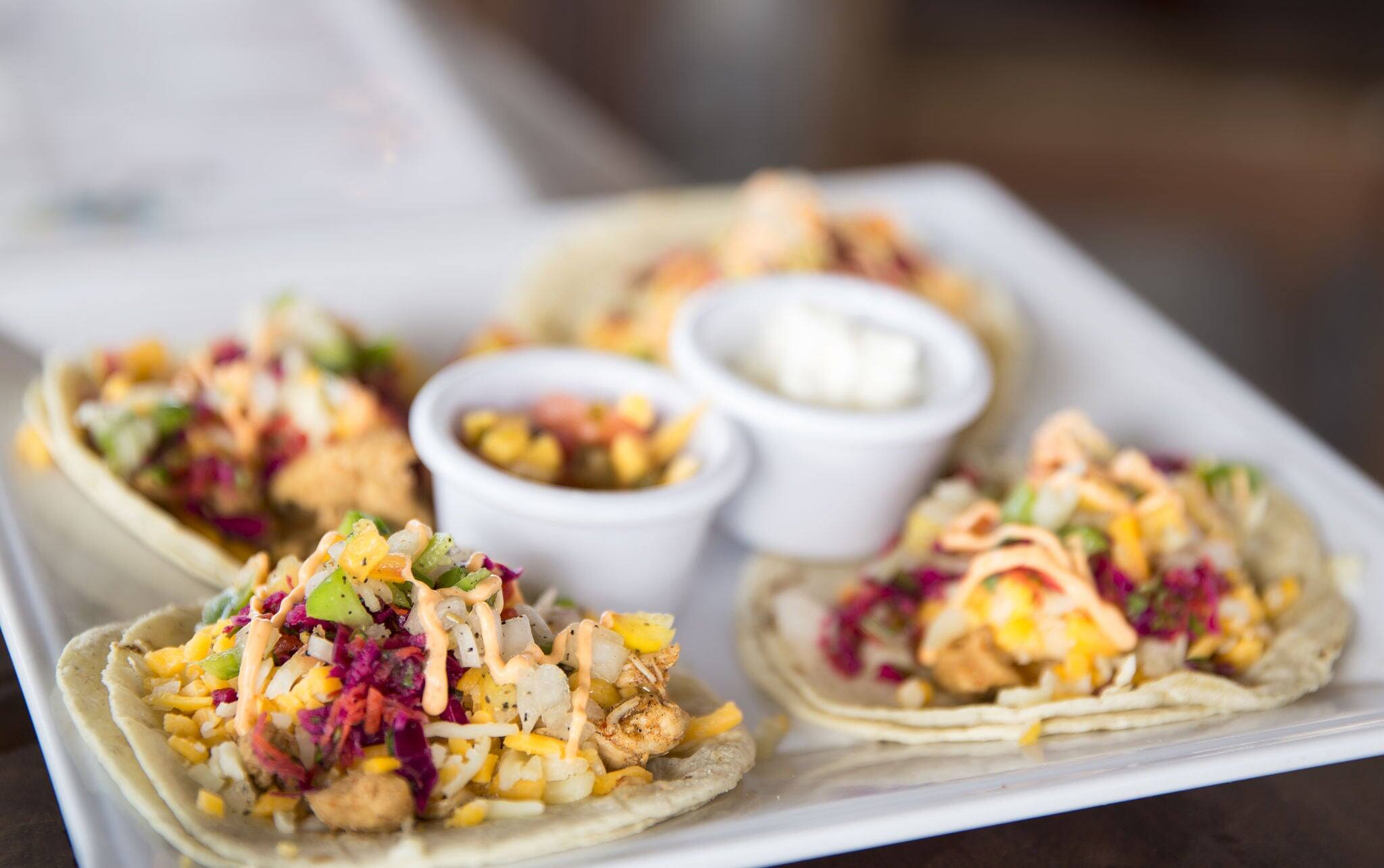 Fish Tacos Platter with Sauces at Tropical Island Restaurant Cafe