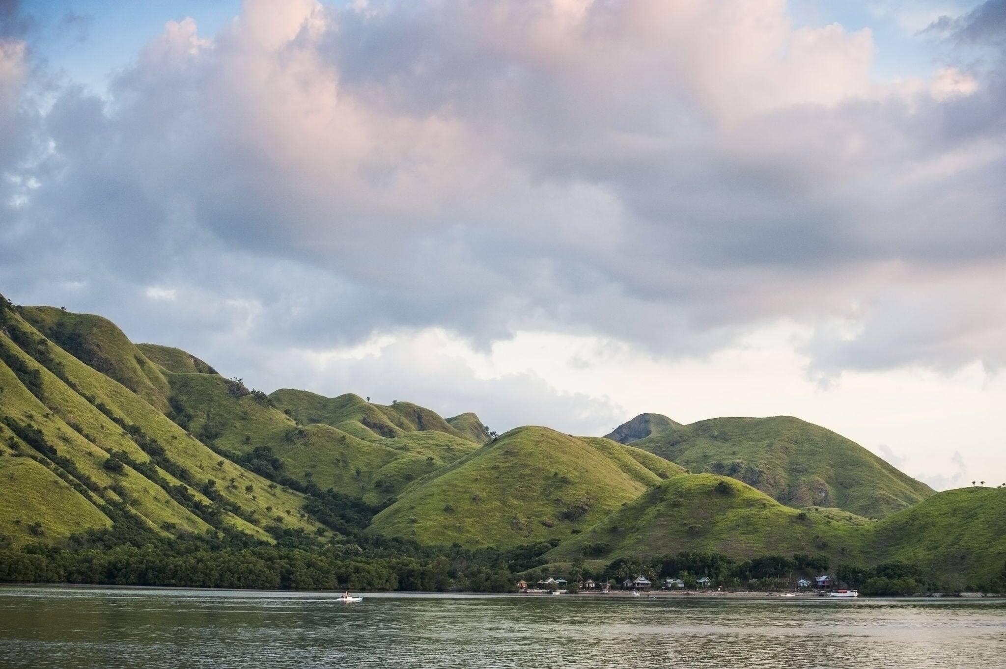 Komodo Island, Indonesia. Komodo is an Indonesian island home to approximately 2,000 people who are mostly descendants of former convicts once exiled here. It's also home to the famous Komodo Dragons.