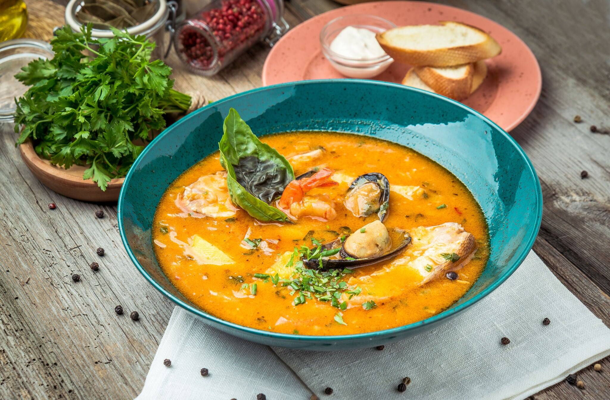 French Bouillabaisse fish soup with seafood, salmon fillet, shrimp, rich taste, tasty dinner