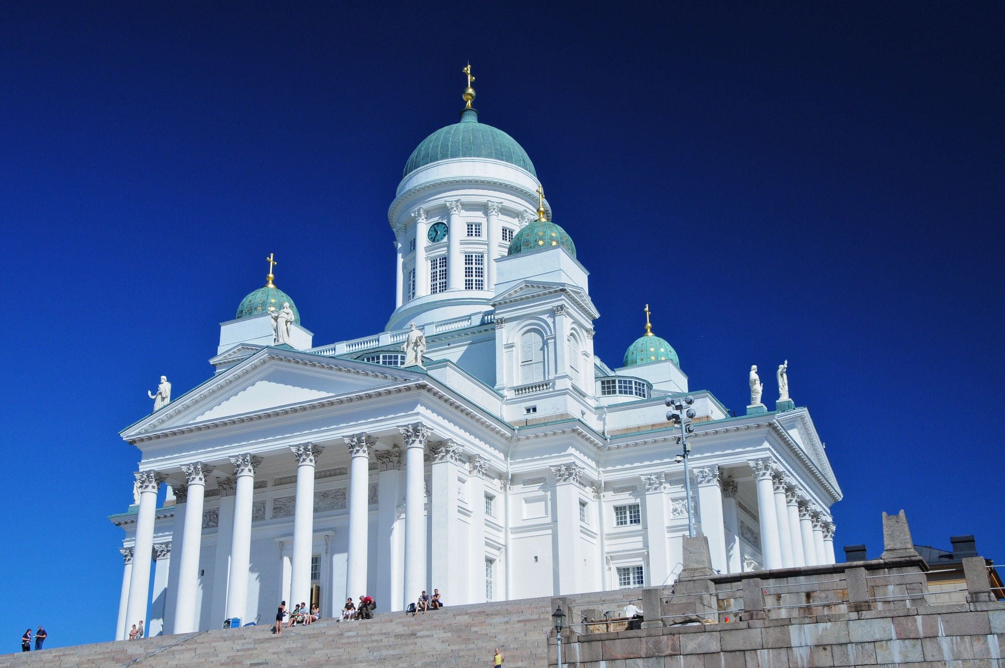 White iconic cathedral in Helsinki, Finland with deep blue sky