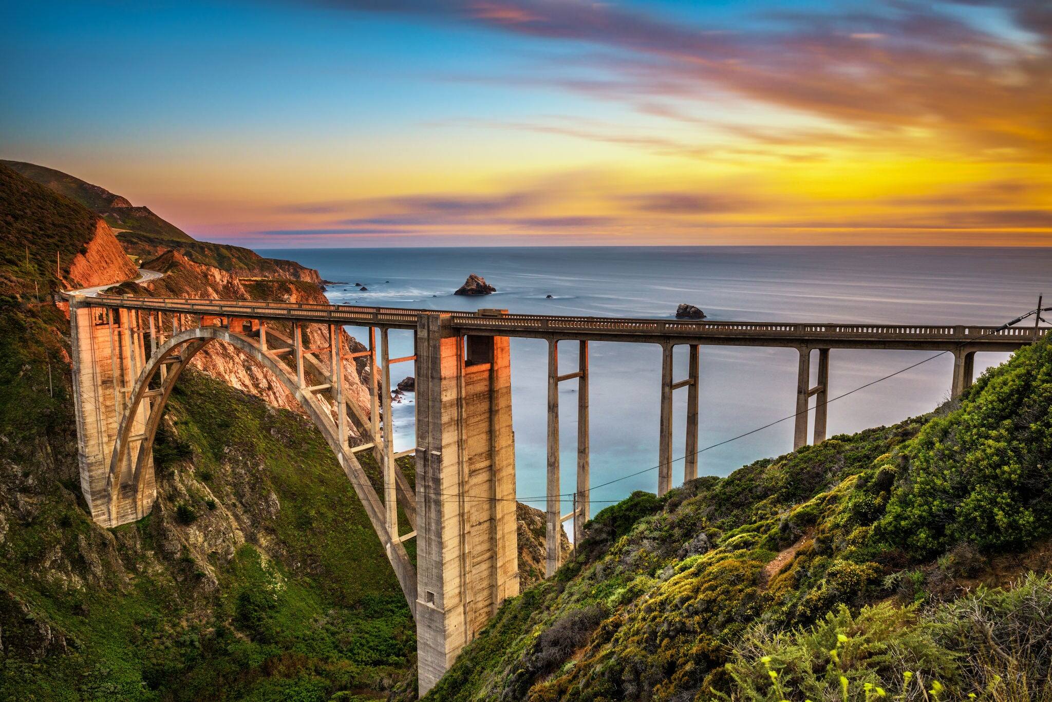 Bixby Bridge (Rocky Creek Bridge) and Pacific Coast Highway at sunset near Big Sur in California, USA. Long exposure.