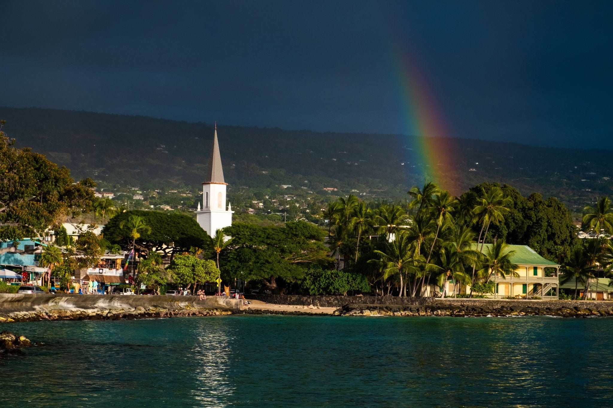 White church and rainbow over the city of Kailua Kona, Big Island, Hawaii
