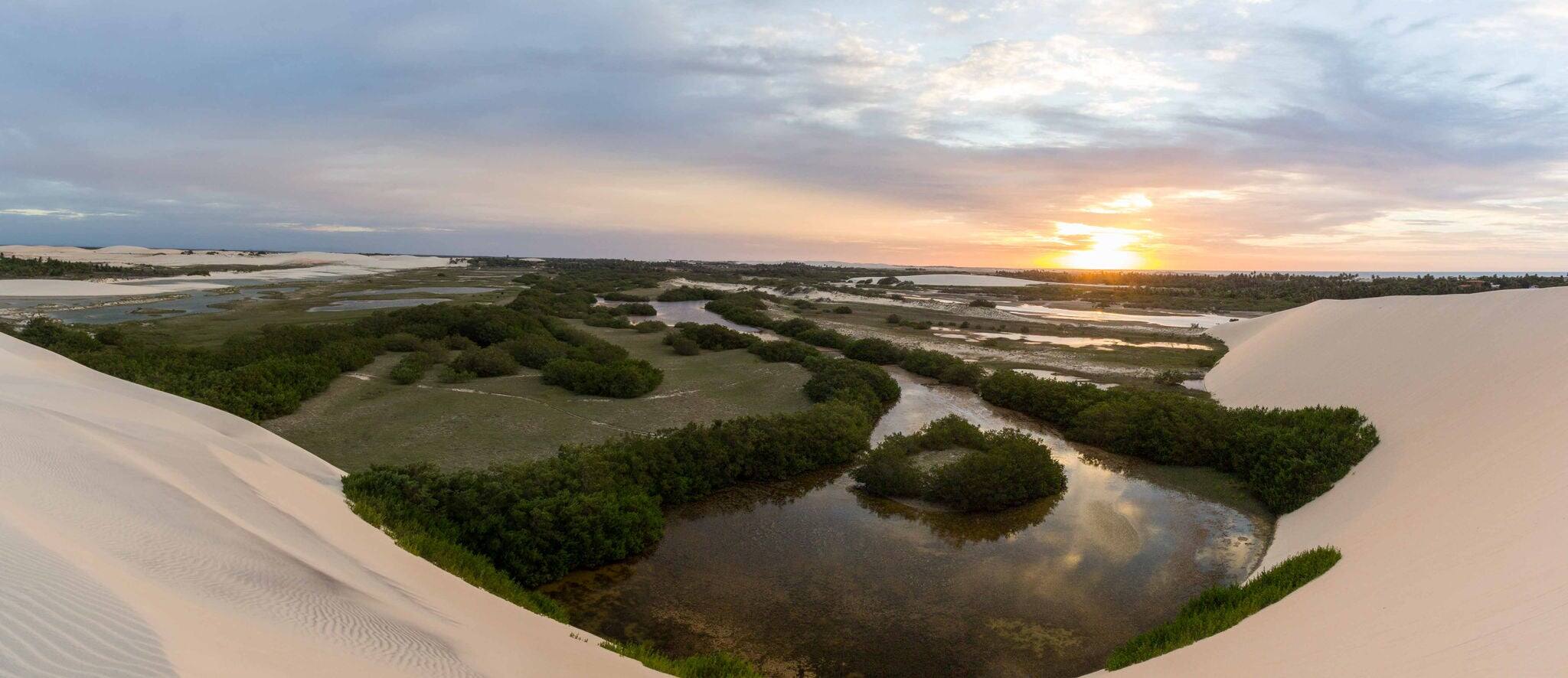A beautiful sunset on a dune of Tatajuba near Jericoacoara, in Ceara state, Brazil
