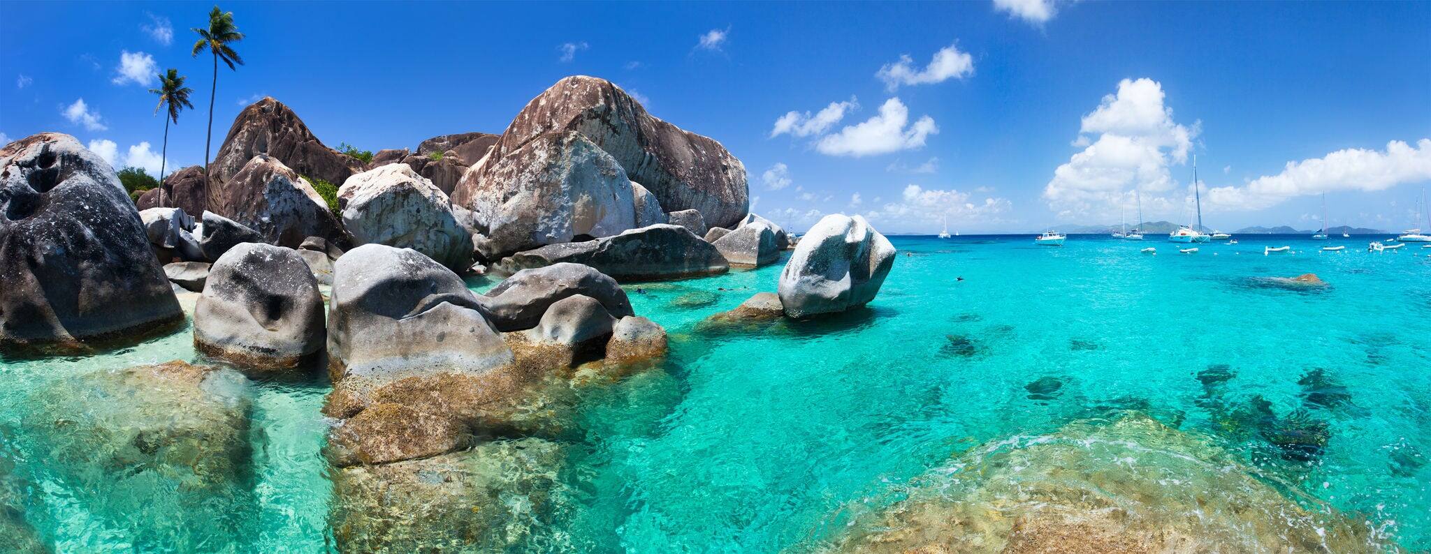 The Baths beach area major tourist attraction at Virgin Gorda, British Virgin Islands with turquoise water and huge granite boulders