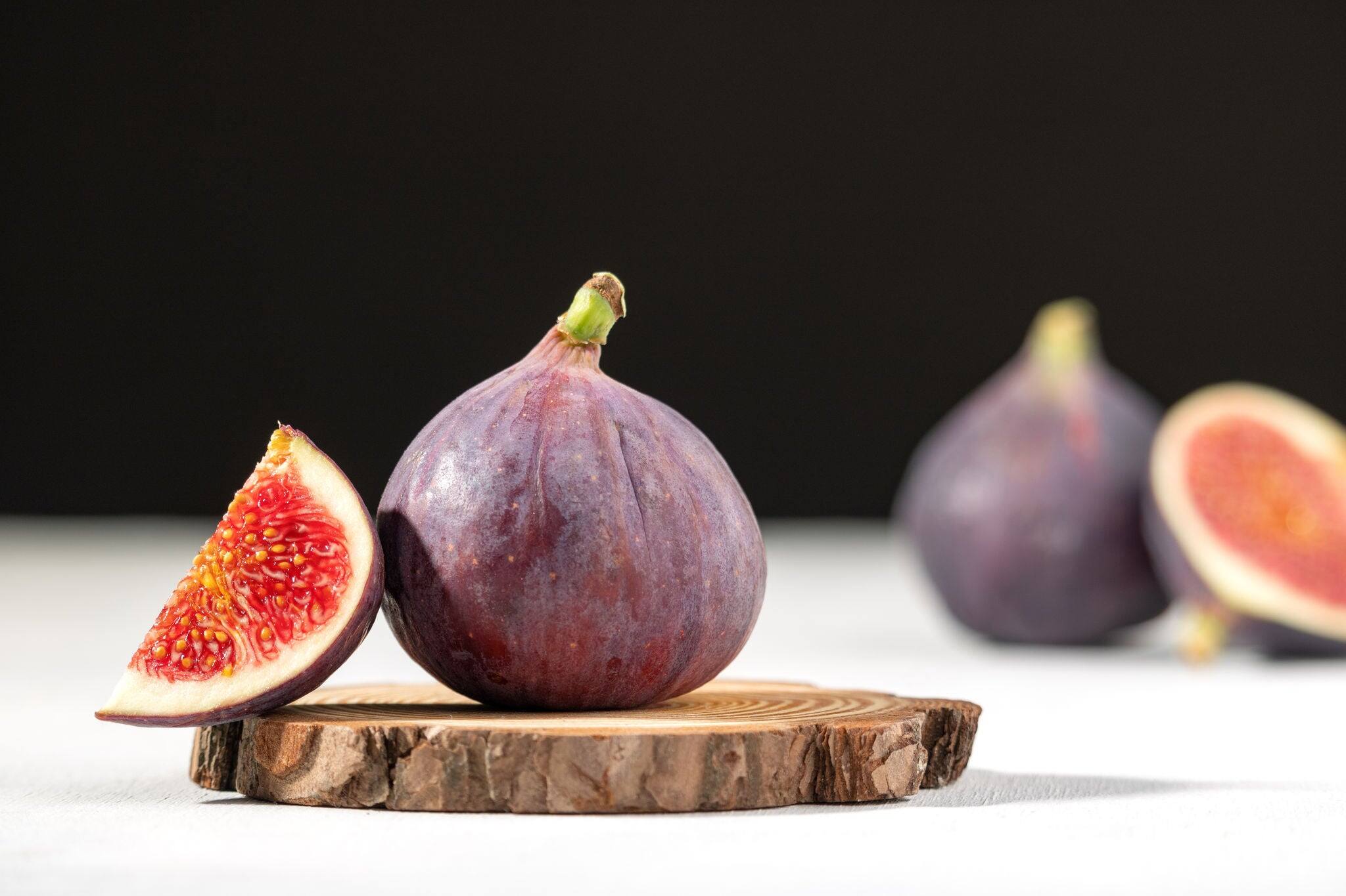 Fresh figs. Halved fig. Juicy fig. Mediterranean fruit.