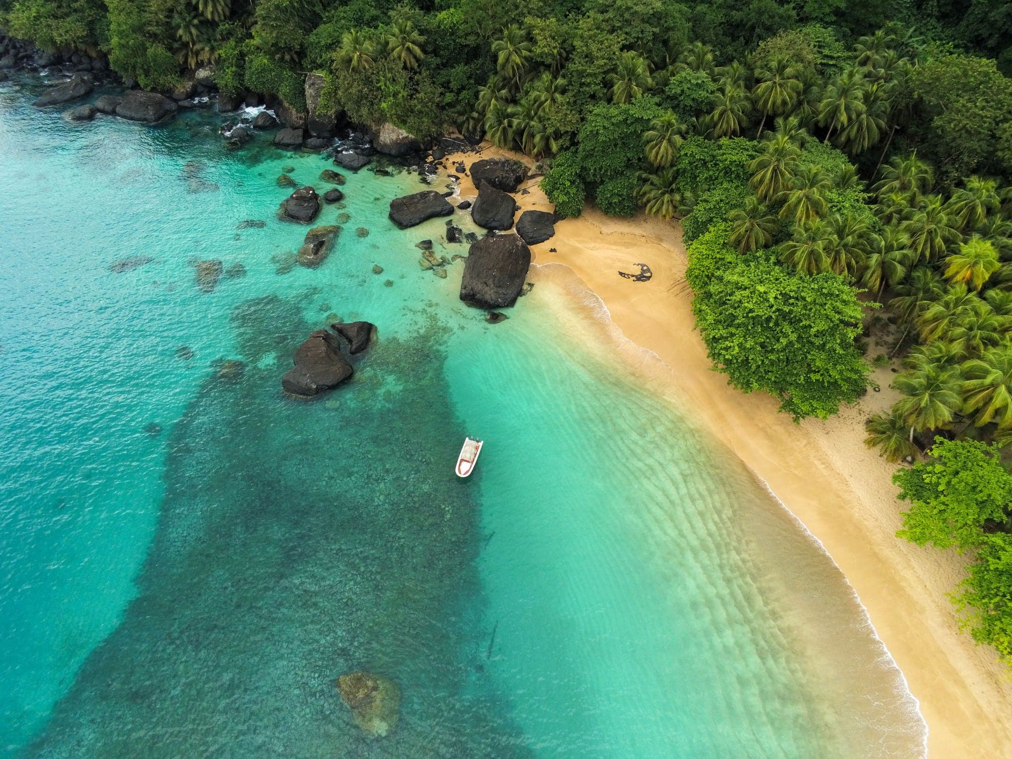 Aerial view from Banana beach in Prince Island,where we can also see a boat and we can appreciate the beauty of the sea and its transparency.São Tomé,Africa