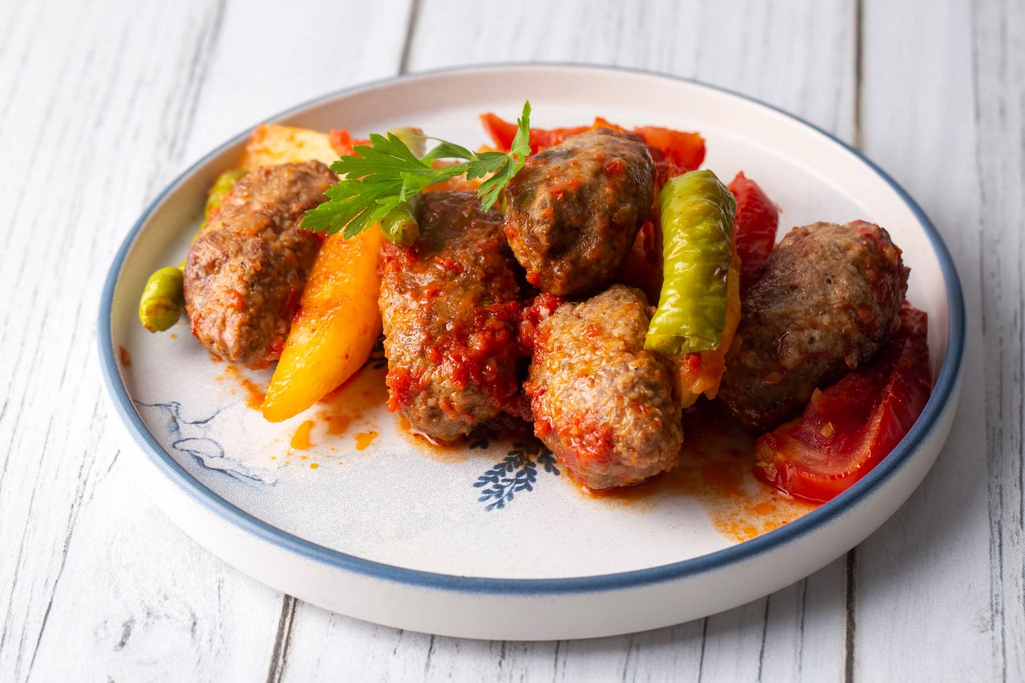 Traditional Homemade Turkish Food Kofte - Kofta with Tomato Sauce and Potatoes. (Turkish name; Izmir kofte)