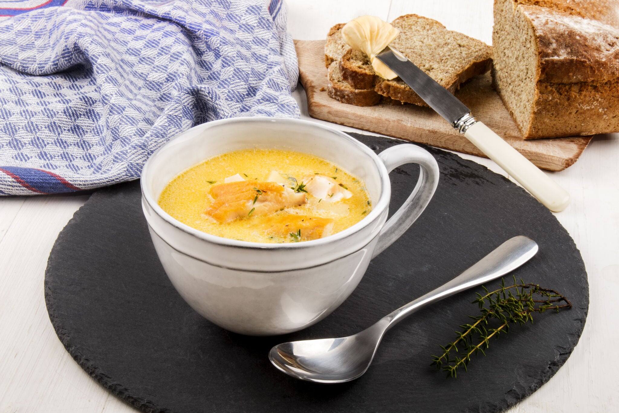 specialty from scotland, freshly cooked cullen skink with thyme in a mug on slate