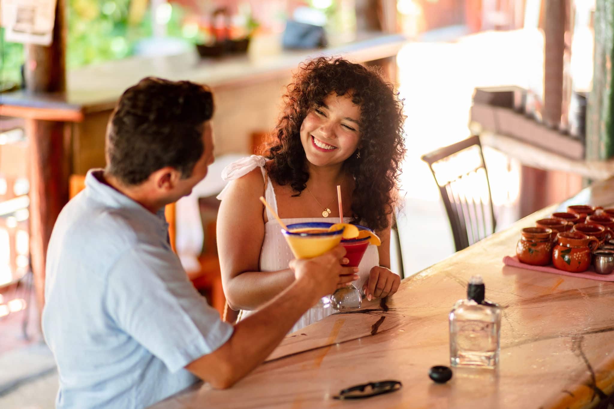 Couple enjoying drinks.