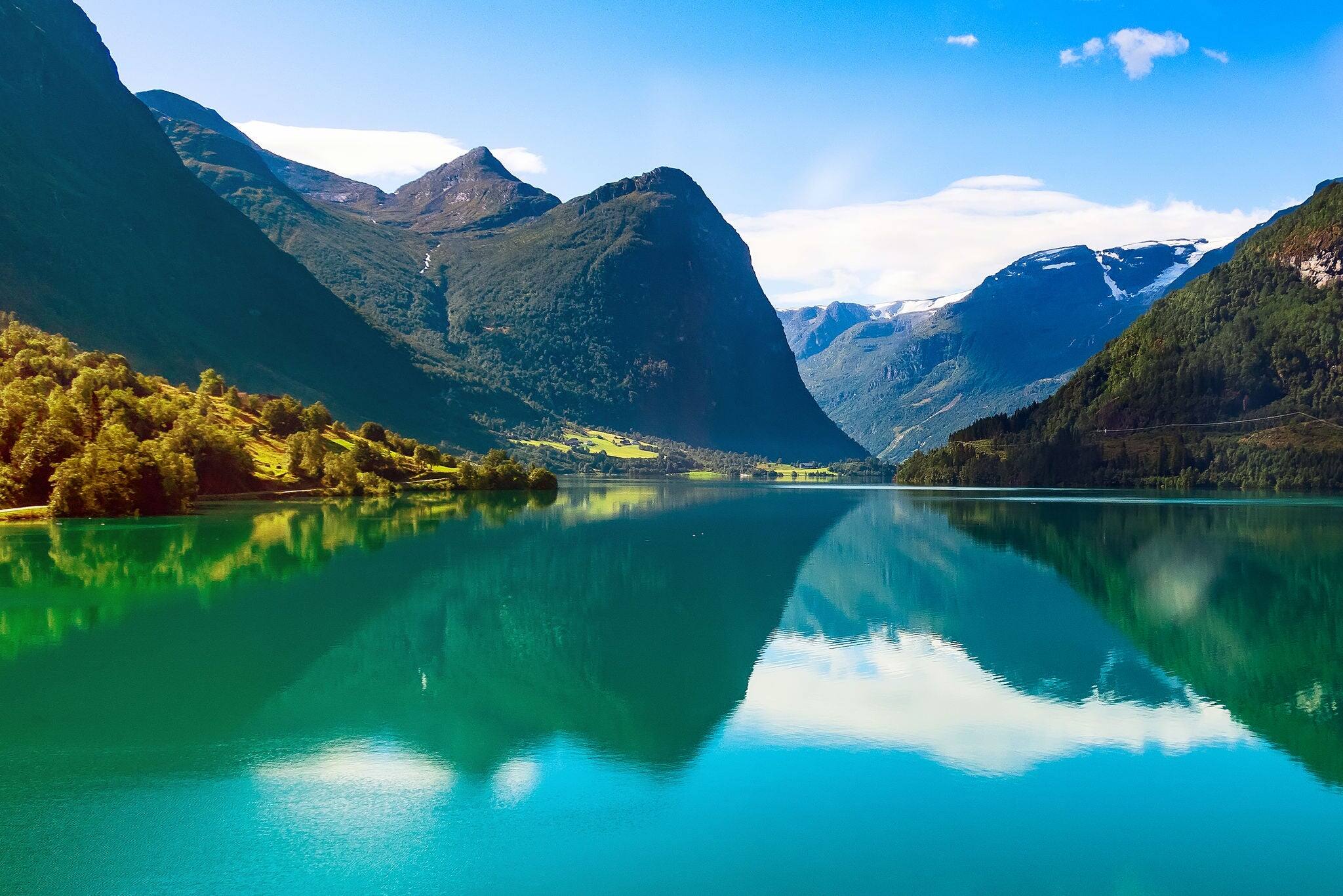Norwegian landscape with Nordfjord fjord, mountains, flowers and glacier in Olden, Norway