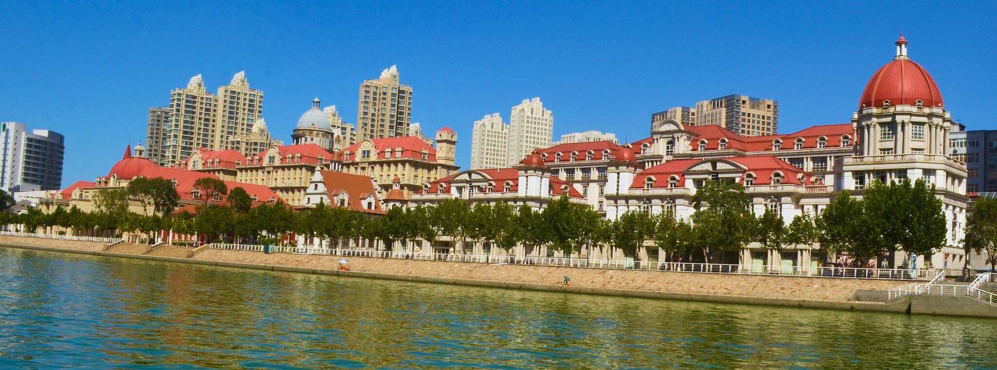 set of historical buildings on a shore of river hai in chinese city tianjin.