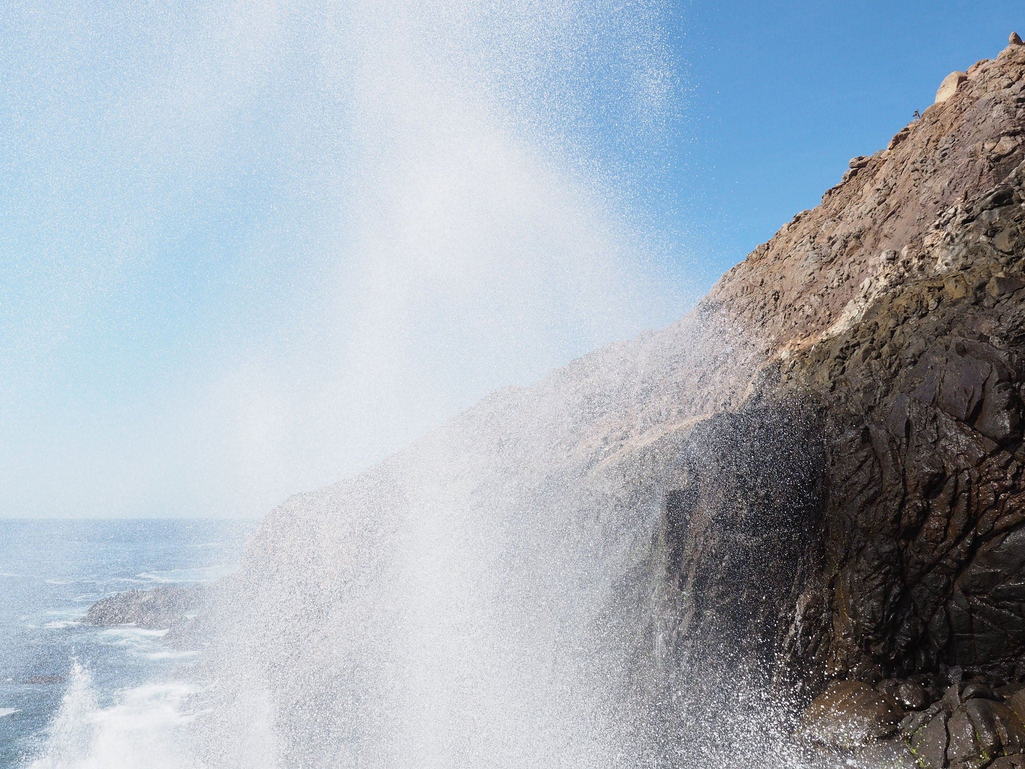 Blowhole with the upward jet of water or marine geyser at La Bufadora, Ensenada, Mexico