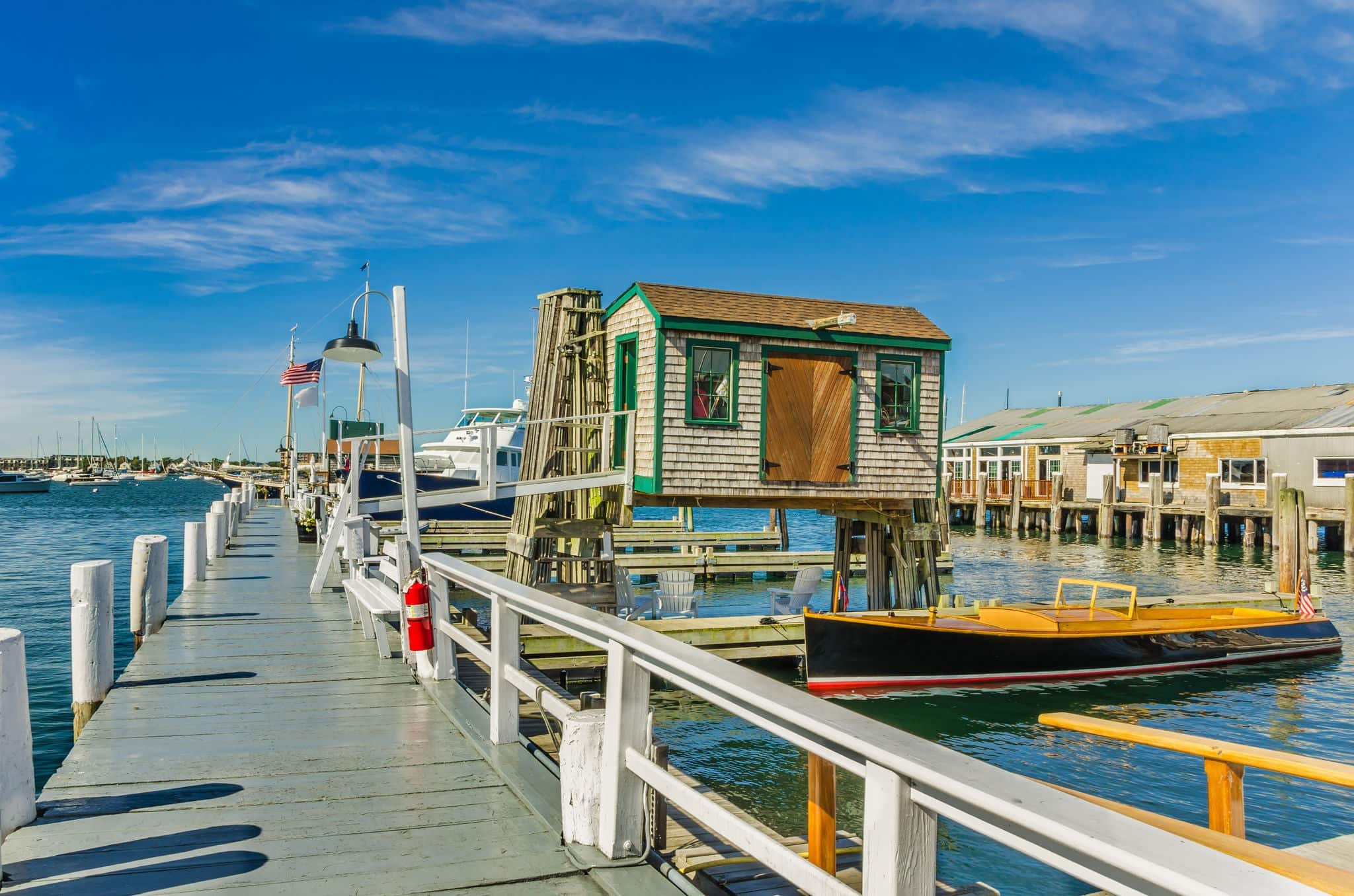 Wooden Pier and Fishing Shed under Blue Sky