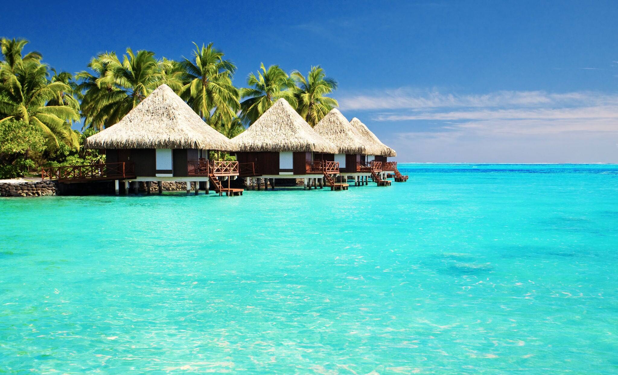 Over water bungalows with steps into amazing green lagoon