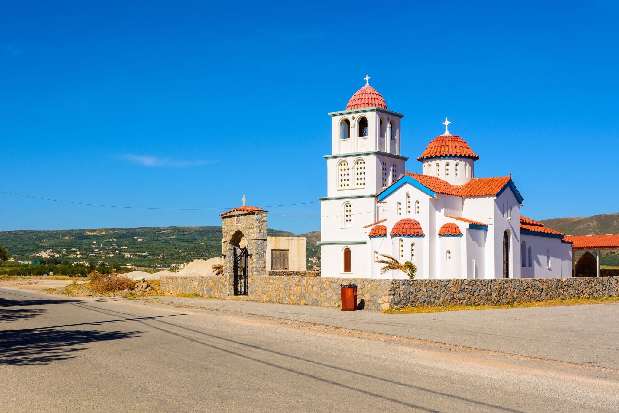 Typical beautiful Greek white church at Kissamos harbor, Crete.  District of Chania. Greece.