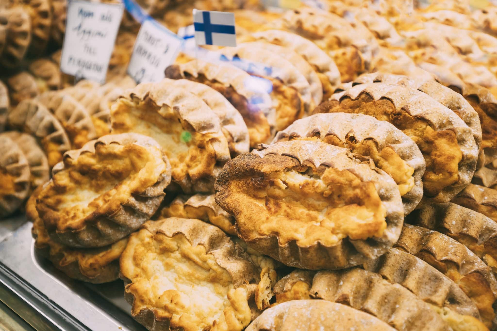 Finnish Traditional Pasties Or Pirogs - Karelian Pasties, Karelian Pies Or Karelian Pirogs From Region Of Karelia. Finland As Well As In Neighbouring Estonia And Northern Russia. Rustic Homemade Bread
