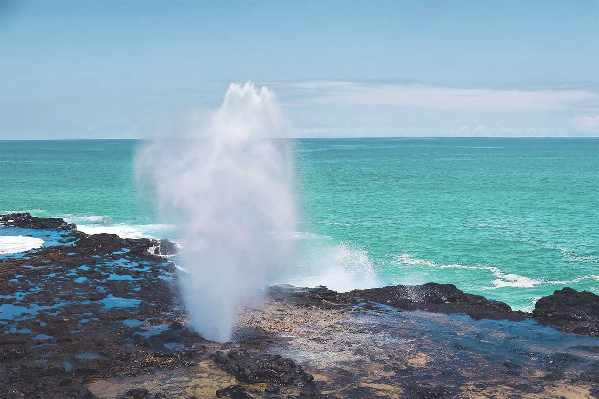 Water spouting up through the rocks.
