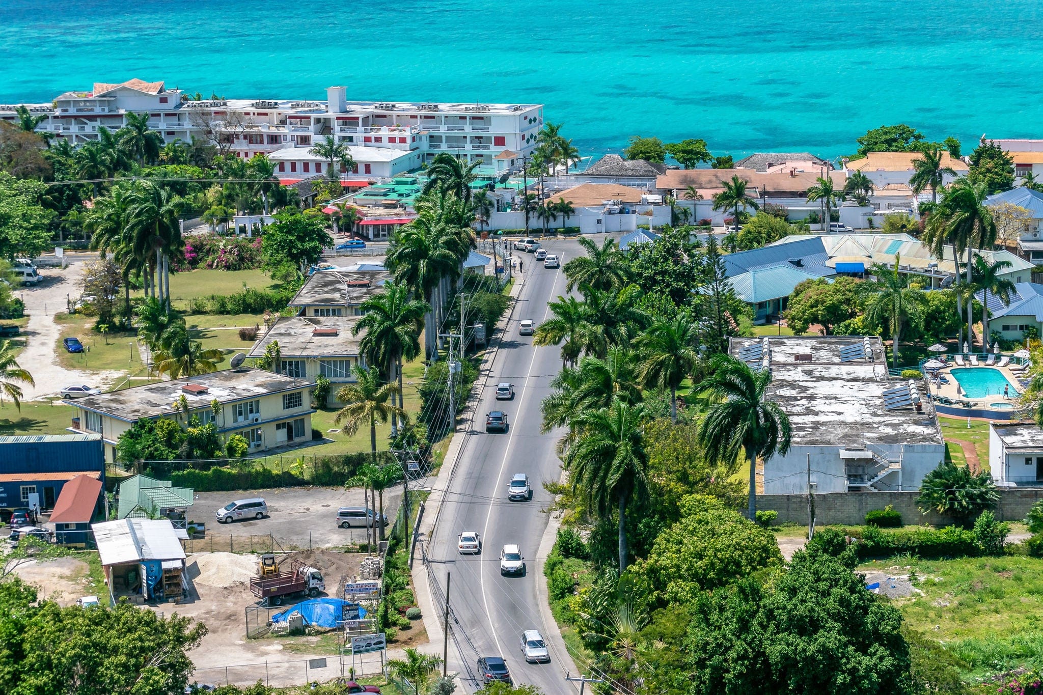 Montego Bay, Jamaica - March 27 2015: Aerial/Drone view near coastline in tourism resort city of Montego Bay, Jamaica. Turquoise ocean water along the coast of tropical Caribbean island.