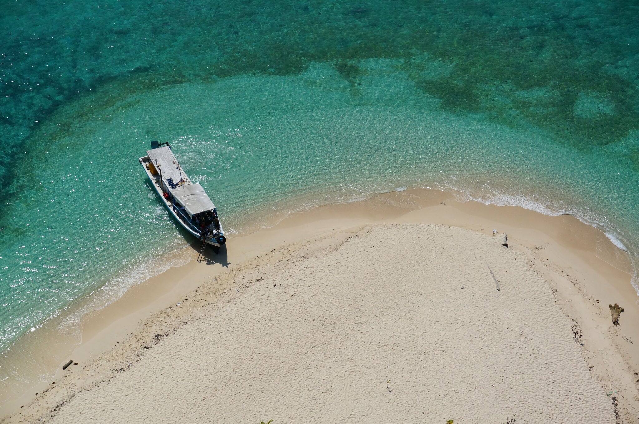 the boat docked on the beach