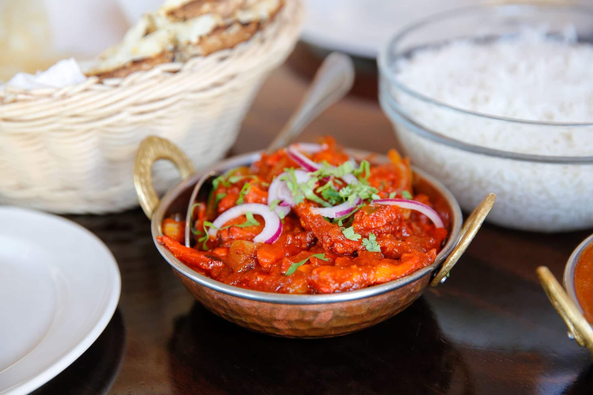 Tasty Indian Chicken tikka masala with Steamed rice with fresh tomato sauce served in cafe, Timaru, New Zealand