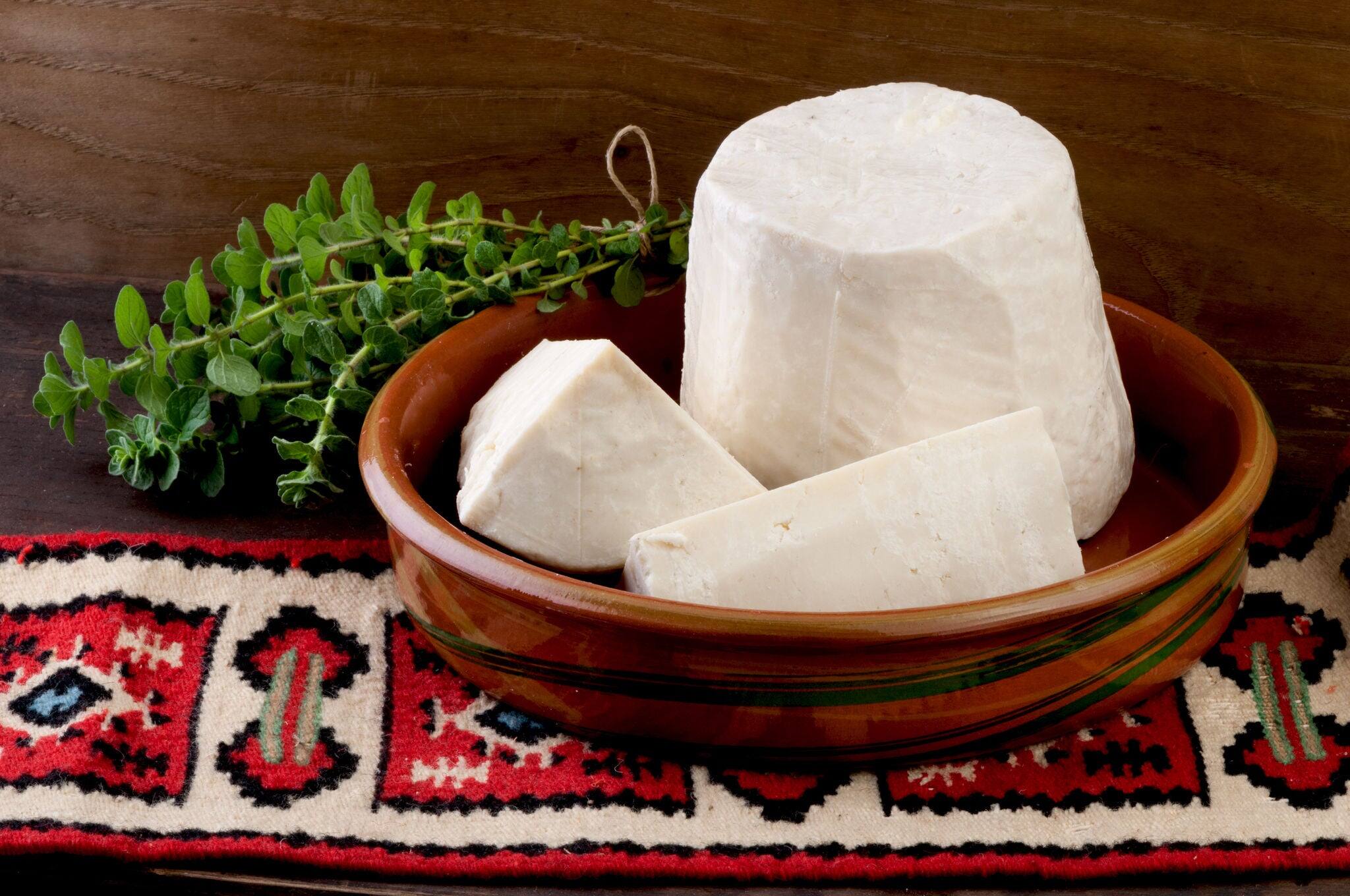 Traditional greek white cheese made from goat and sheep's milk. Folklore background