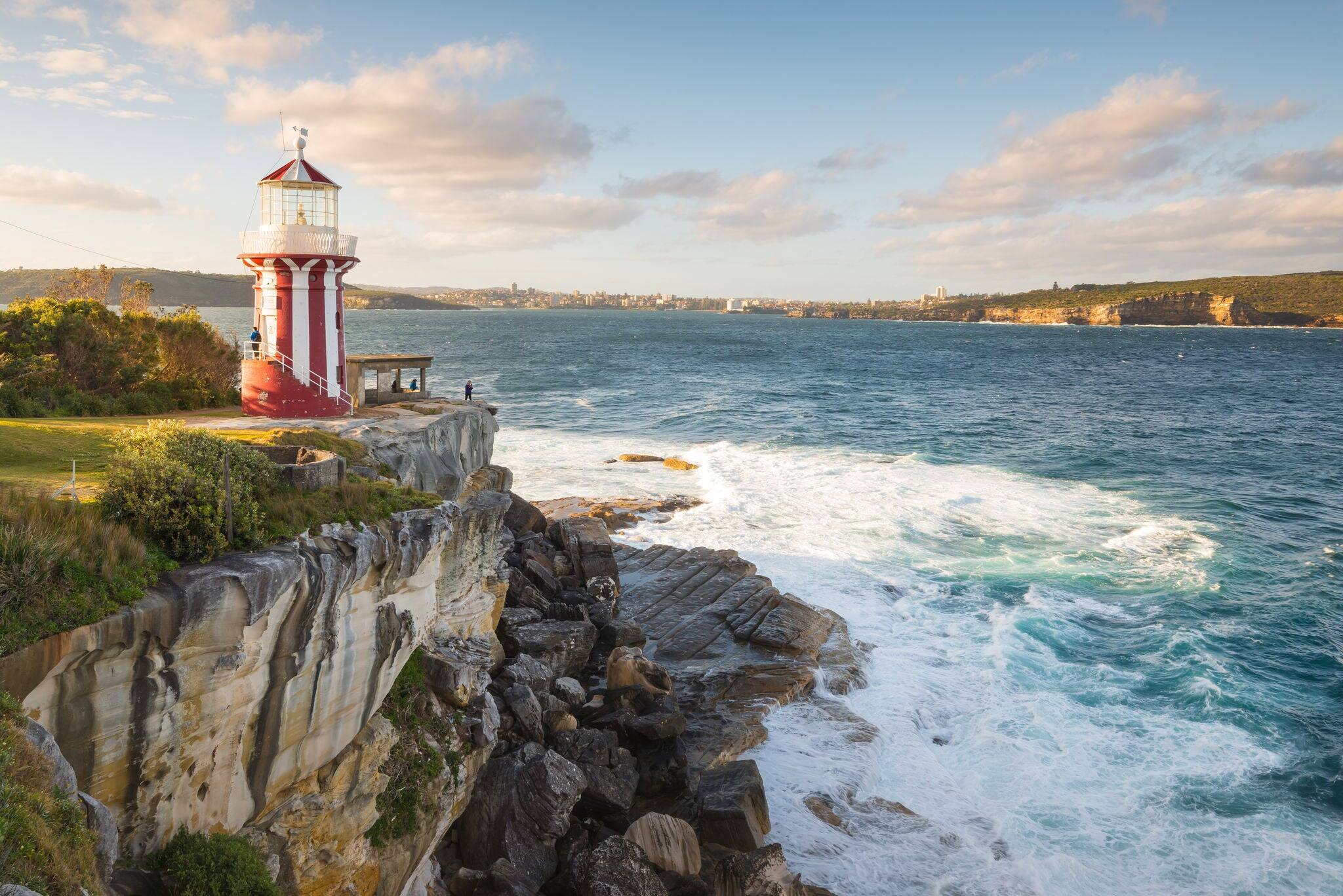 The beautiful red and white Hornby Lighthouse on South Head, Sydney Australia, the entrance to Sydney Harbour, at dawn.