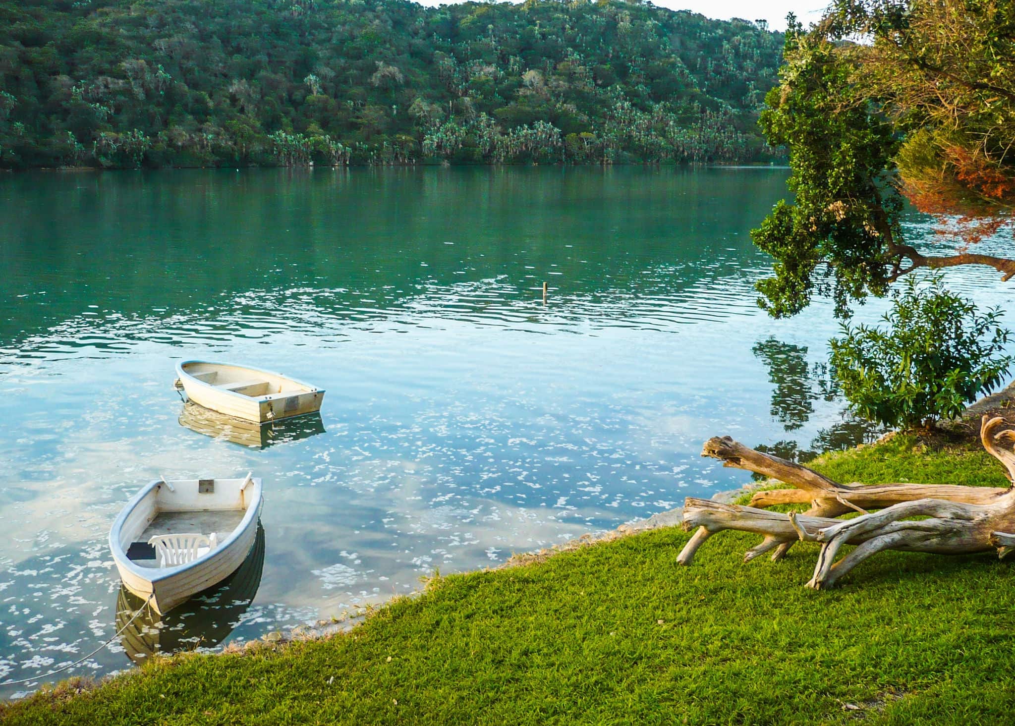 Two little boats on the Gonubie river, East London, South Afrcia at sunset