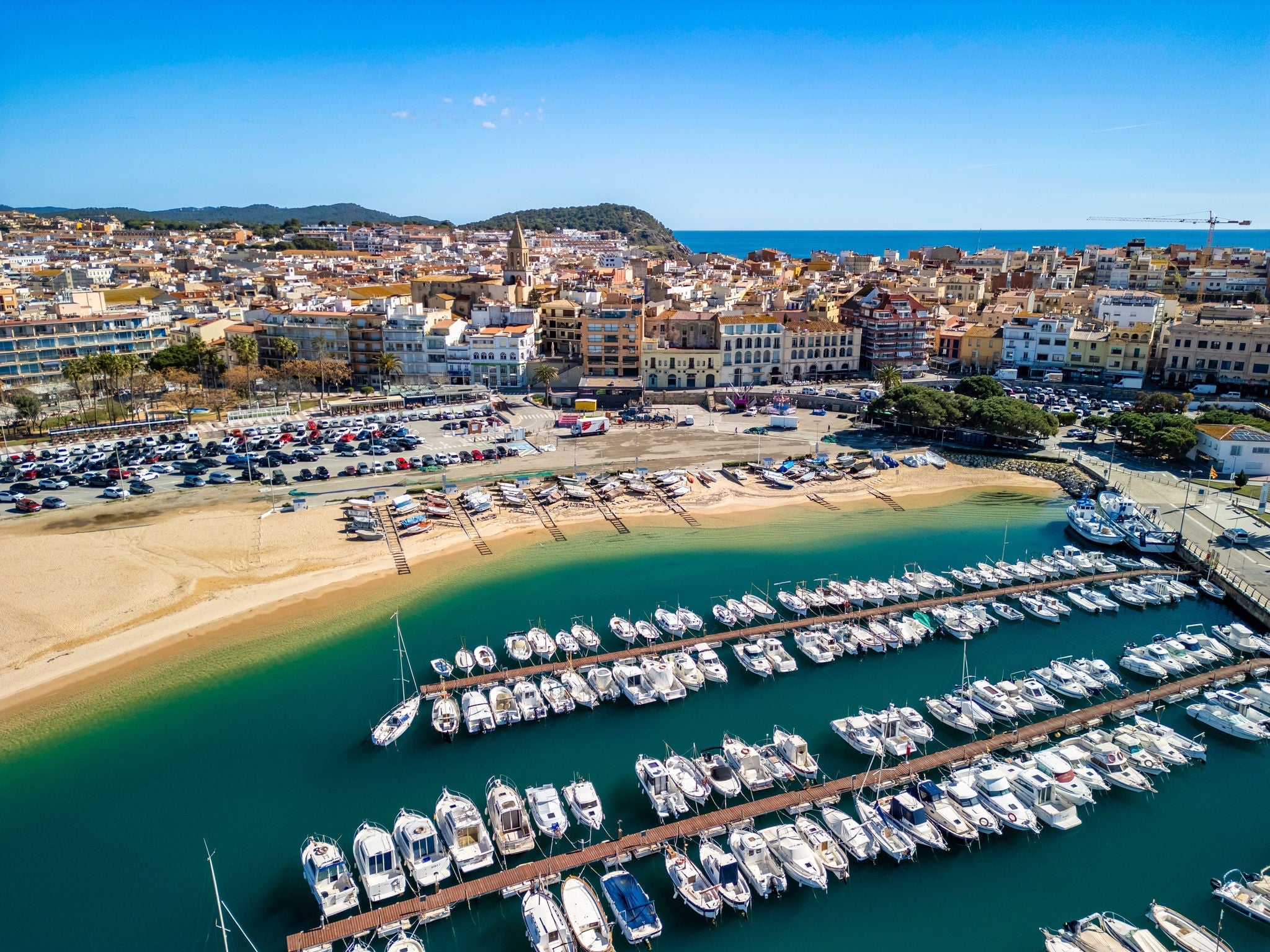 Aerial views reveal the charm of Palamos as a quintessential European tourism destination, with its blend of historic architecture and natural beauty.