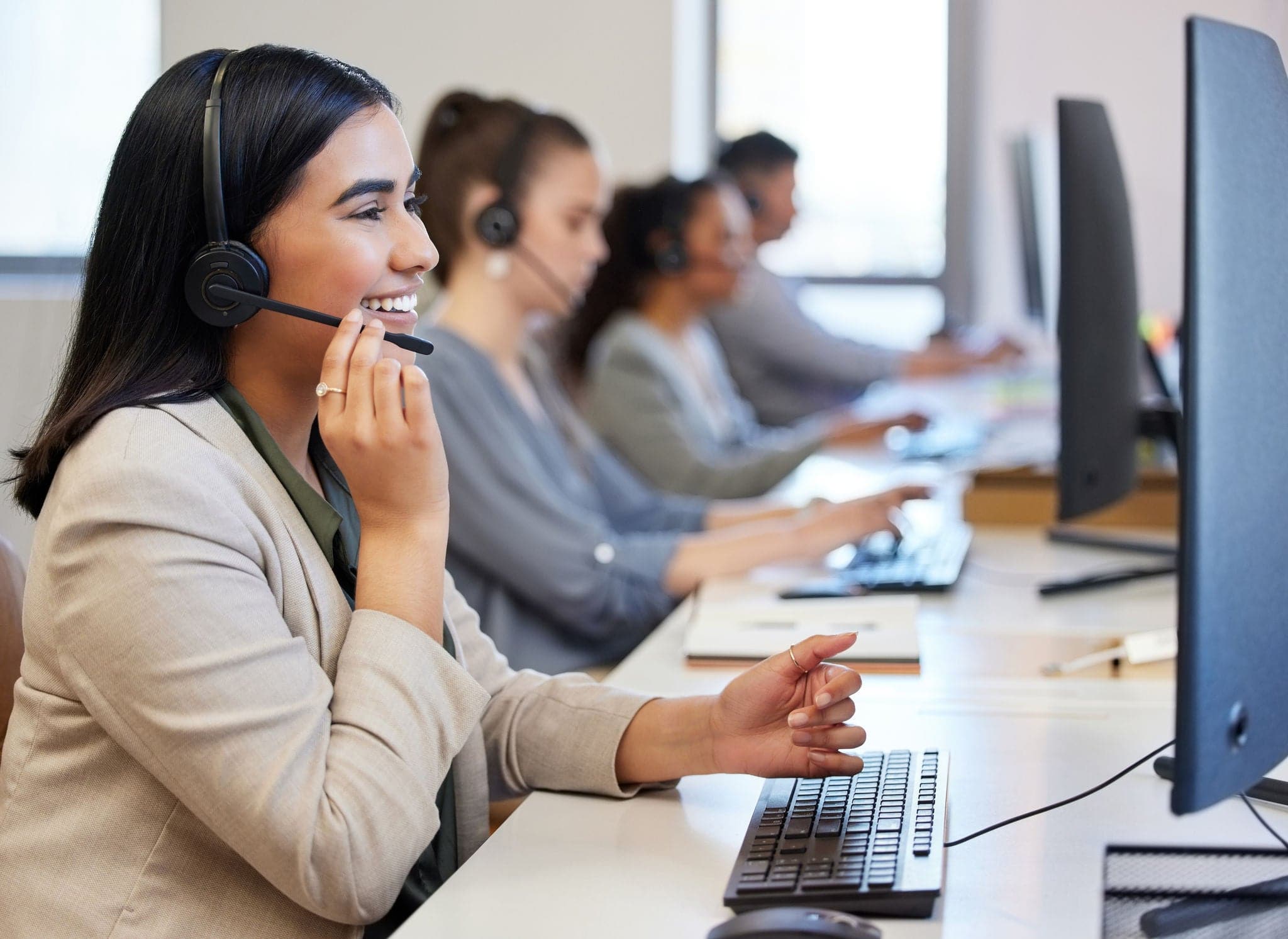 Call center, profile and woman with headset, support and communication in office with pride. Happy, female person and telemarketing agent for deal, consulting and smile for customer service at desk