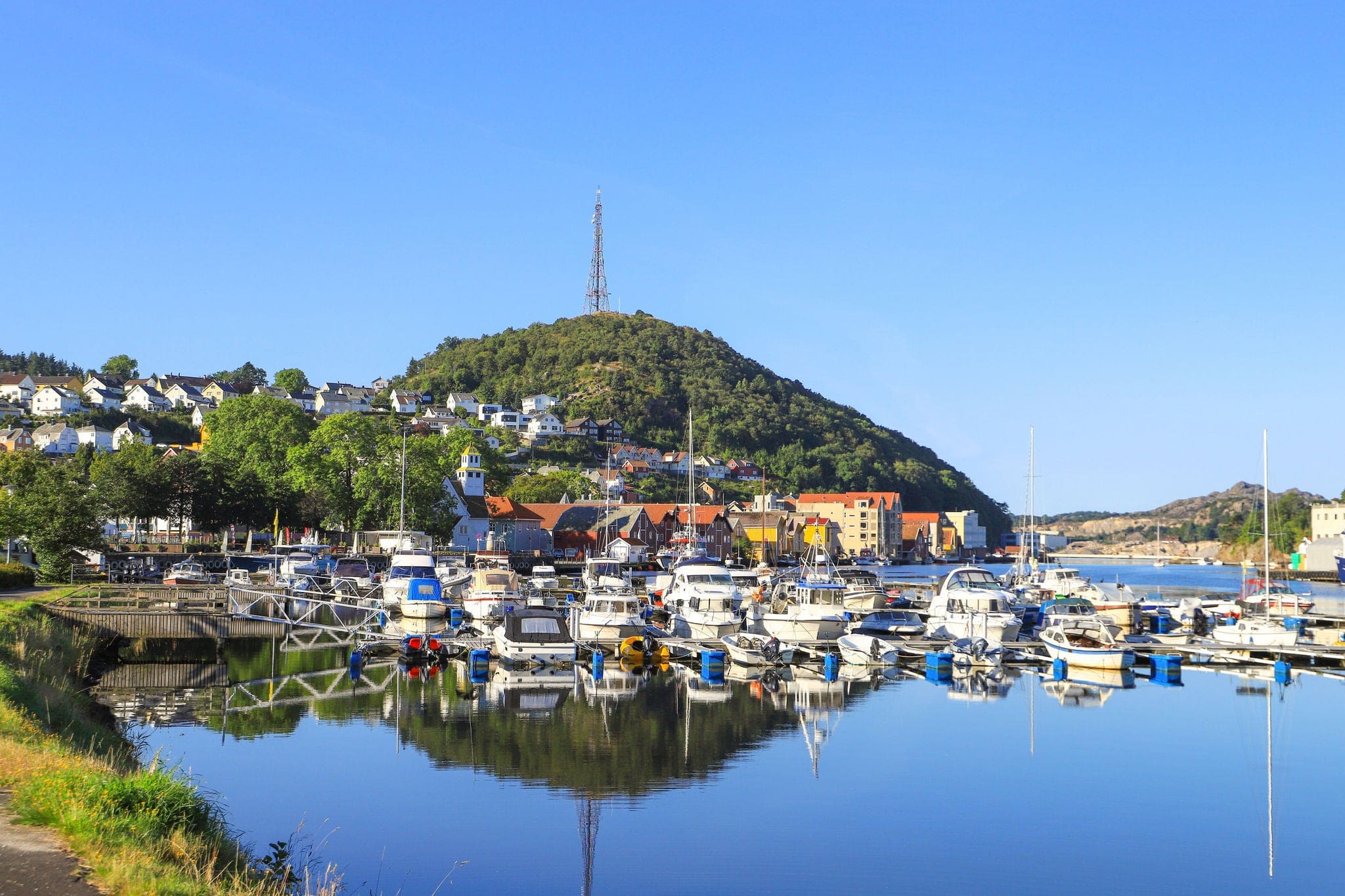 View at the marina in Egersund with the Varberg Mountain and the town in background, south Norway