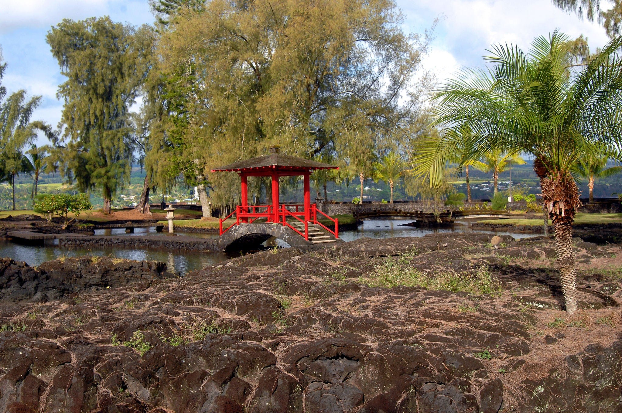 liliuokalani Gardens in Hilo, Hawaii is the largest Edo Style Garden outside of Japan.   Attractive red pagoda pavilion connects several pools inside garden.